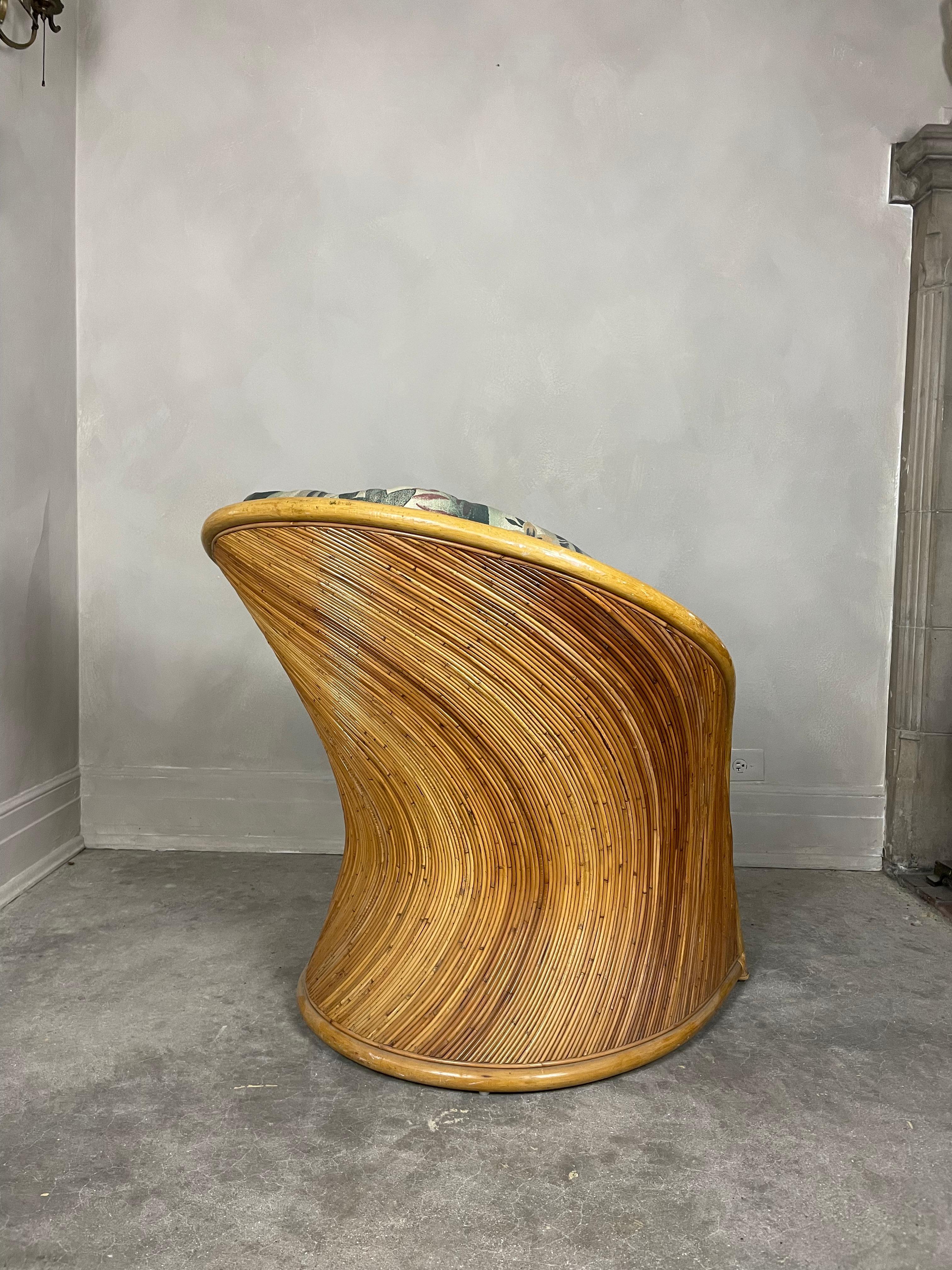 Gorgeous Pencil Reed chair attributed to Adrian Pearsall and Gabriella Creeps. A unique statement piece that features a curvy silhouette.