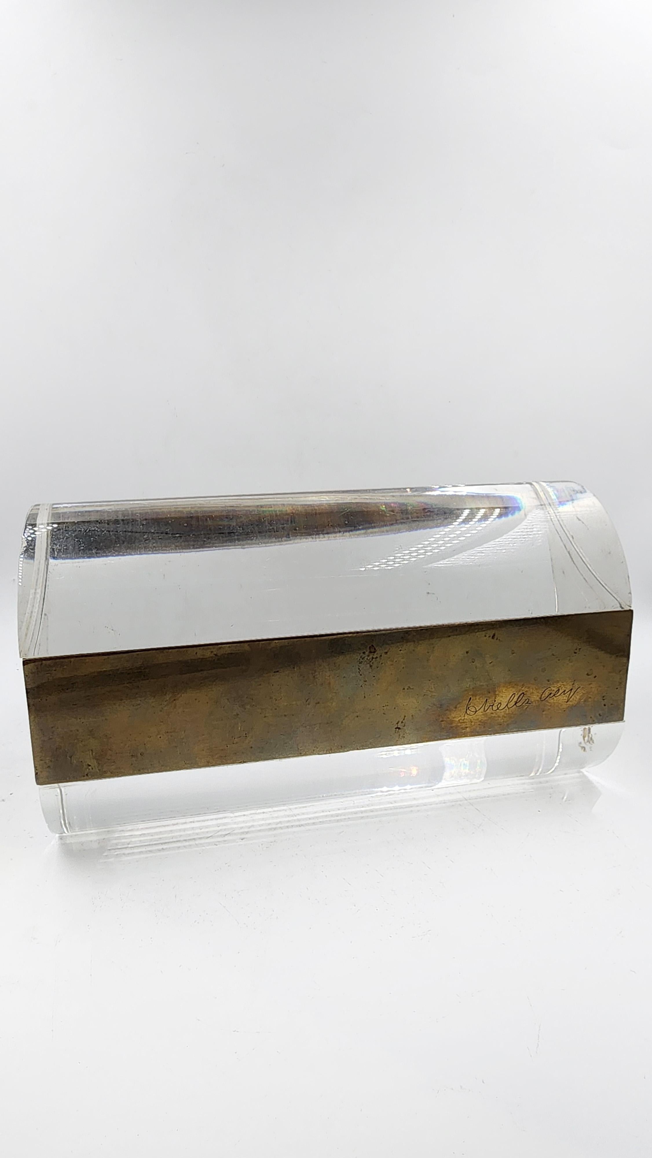 Acrylic box by Gabrielle Crespi, 1970s
The box features a rectangular design with rounded corners, combining the transparency of acrylic with a patinated bronze band that surrounds its center. The bronze, which displays a natural patina over time,