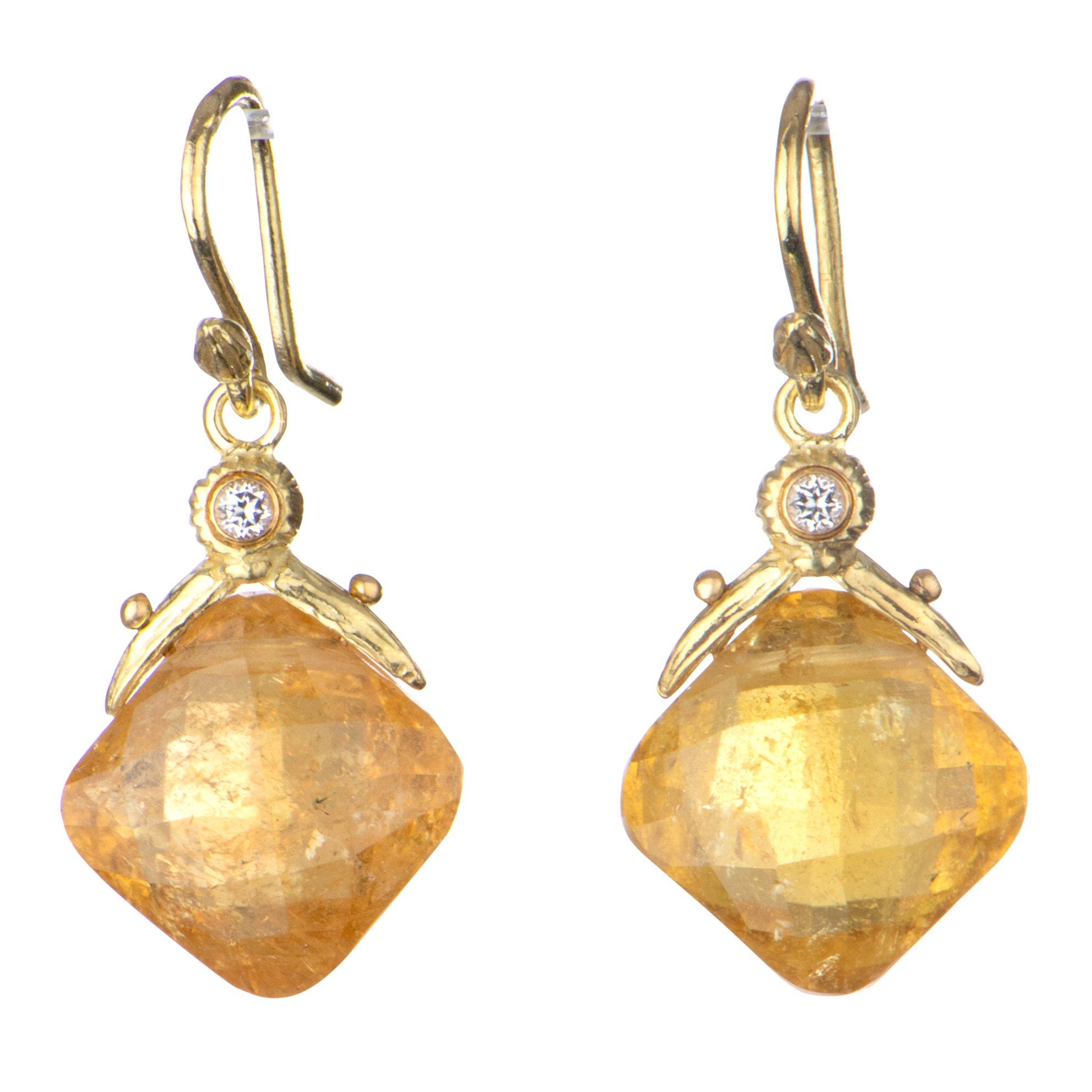 Rare golden spessartite cushion garnets are grandly showcased with their checkerboard facets and white topaz-kissed 18k gold double-seed setting. Hung from French earwires for subtle movement and to catch the light into these stones' warm, fiery