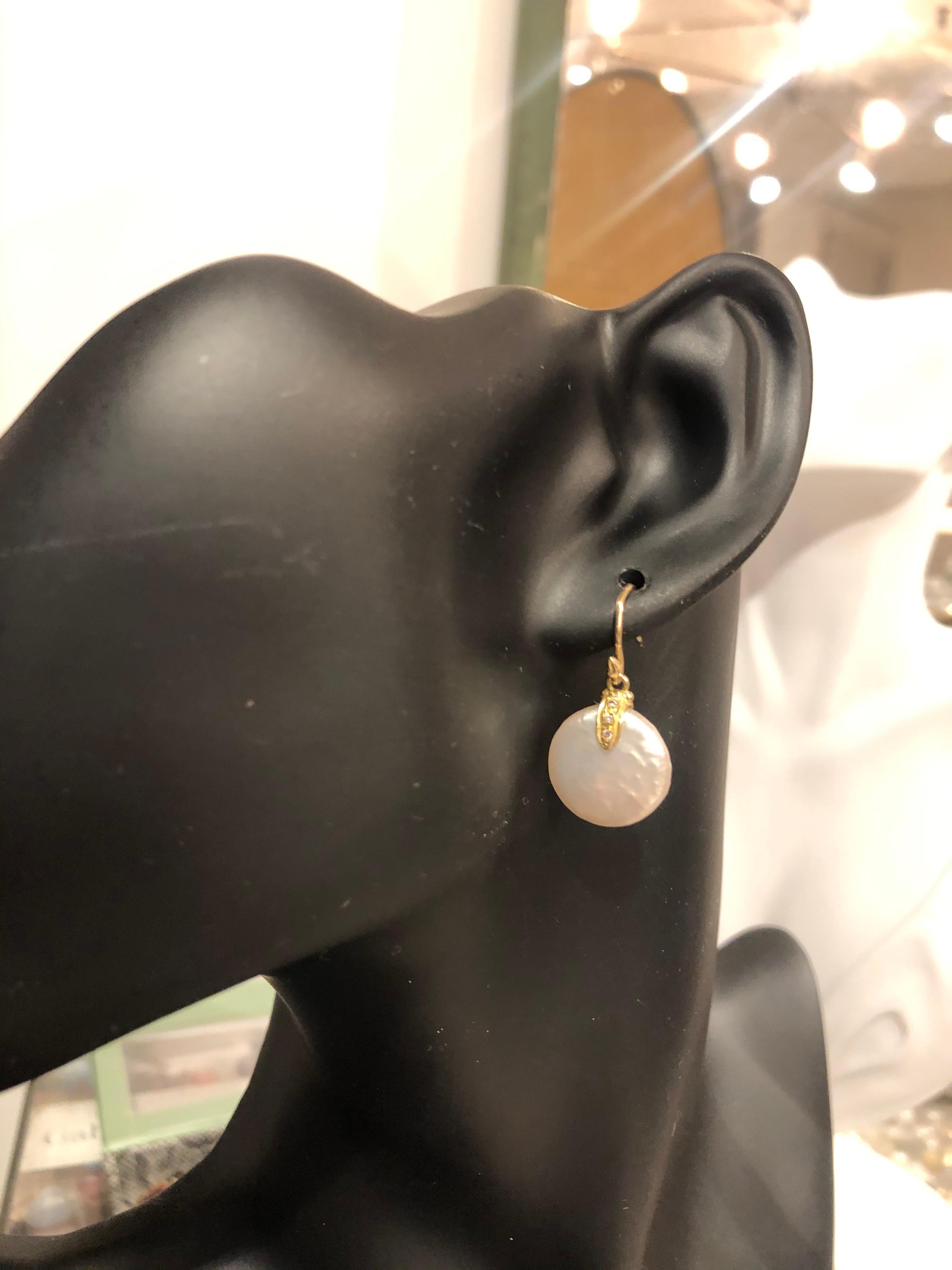 Perfect white freshwater coin pearls dangle from a diamond-pavé seed setting on a single-seed earwire. This is a forever-classic earring, one Gabrielle made famous.
