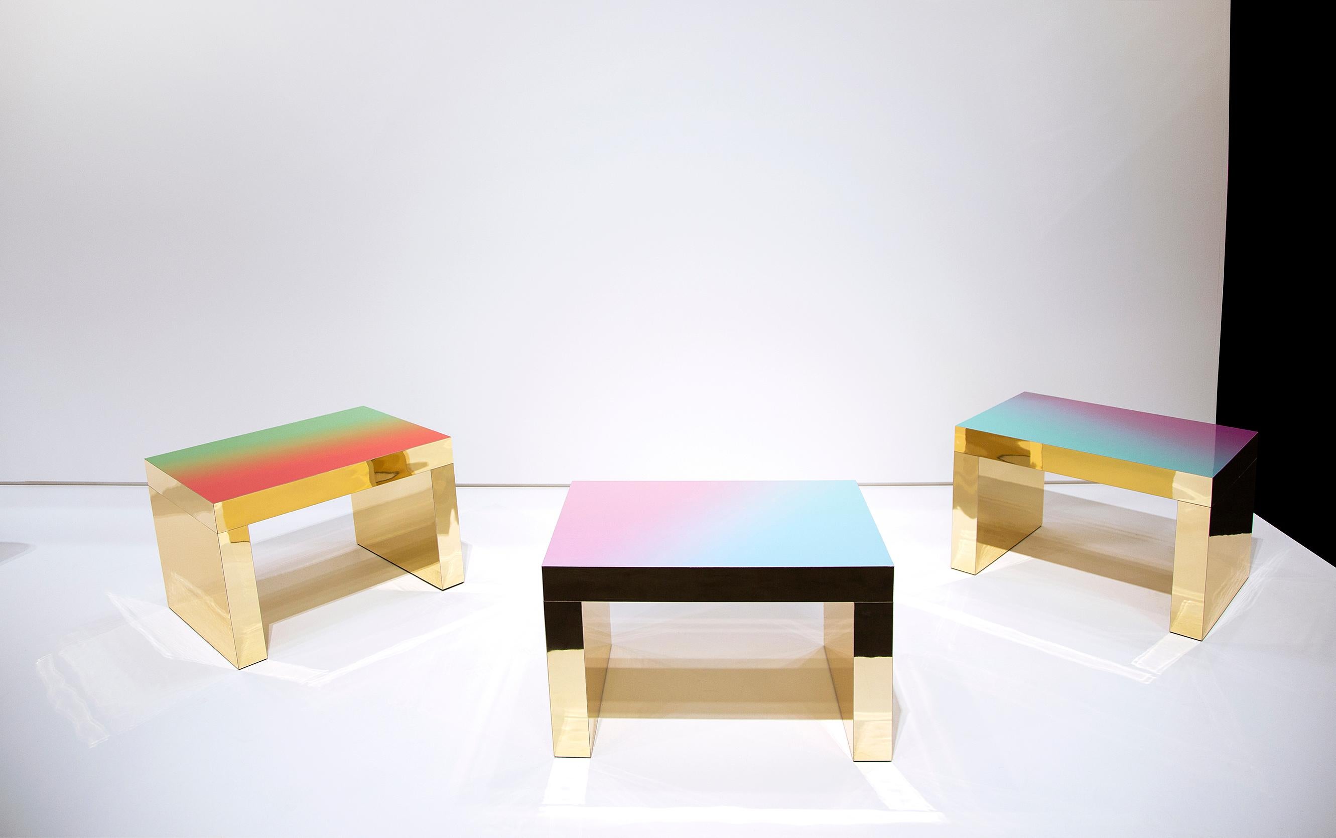 Gaby is a contemporary multifunctional coffee table that features shades of colors with gold mirror reflects. It presents a multicolored top where light seems to cross the matter to play with new chromatic palette as a painting process. 

Colors: