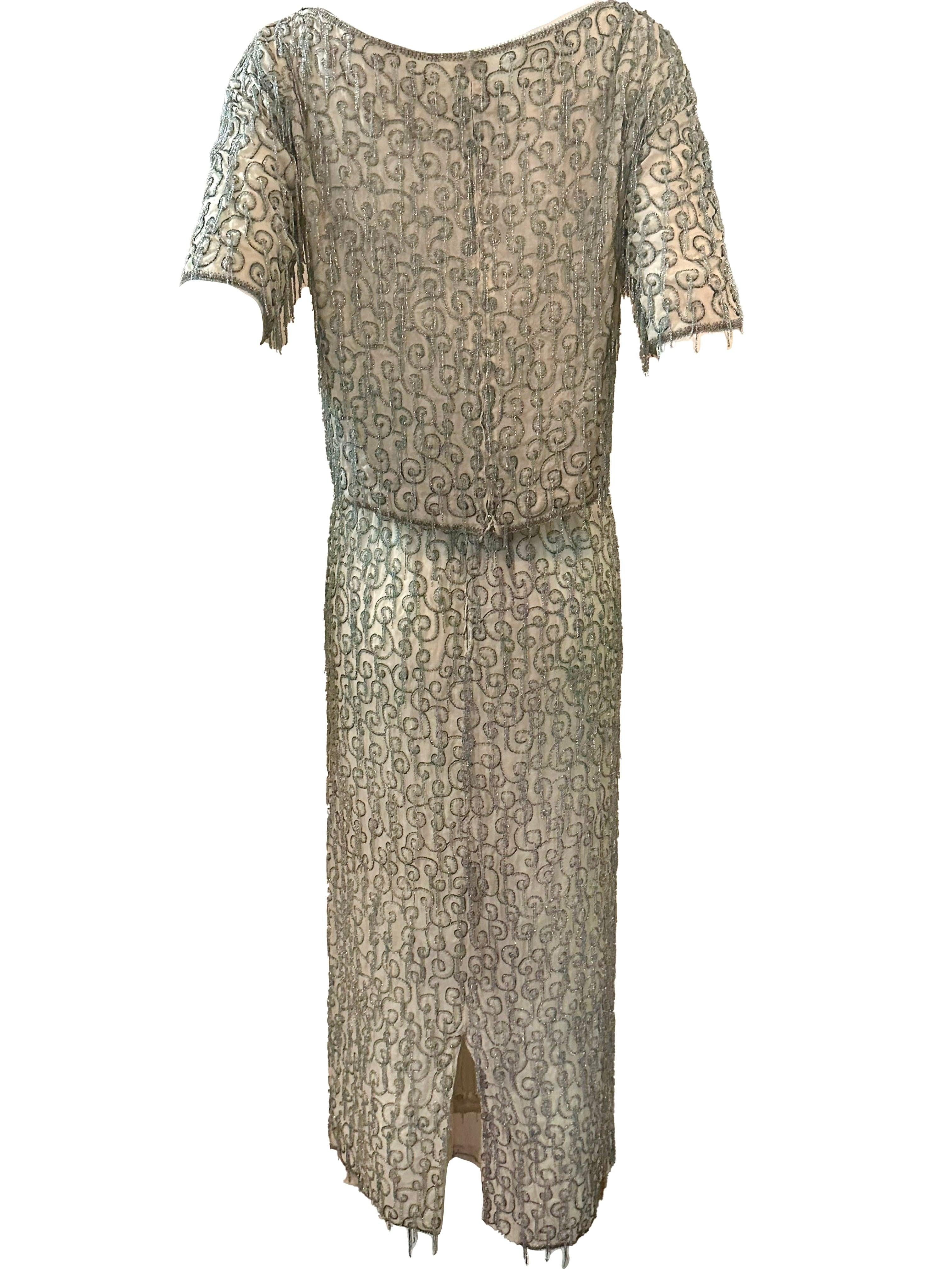 We don't like to use (overuse) the word  rare but sometimes it’s unavoidable. 1960s era Gaby of Espana cocktail or evening ensemble of ivory chiffon festooned with tiny pale blue seed beaded fringe.  Cropped shell top that zips up back paired with