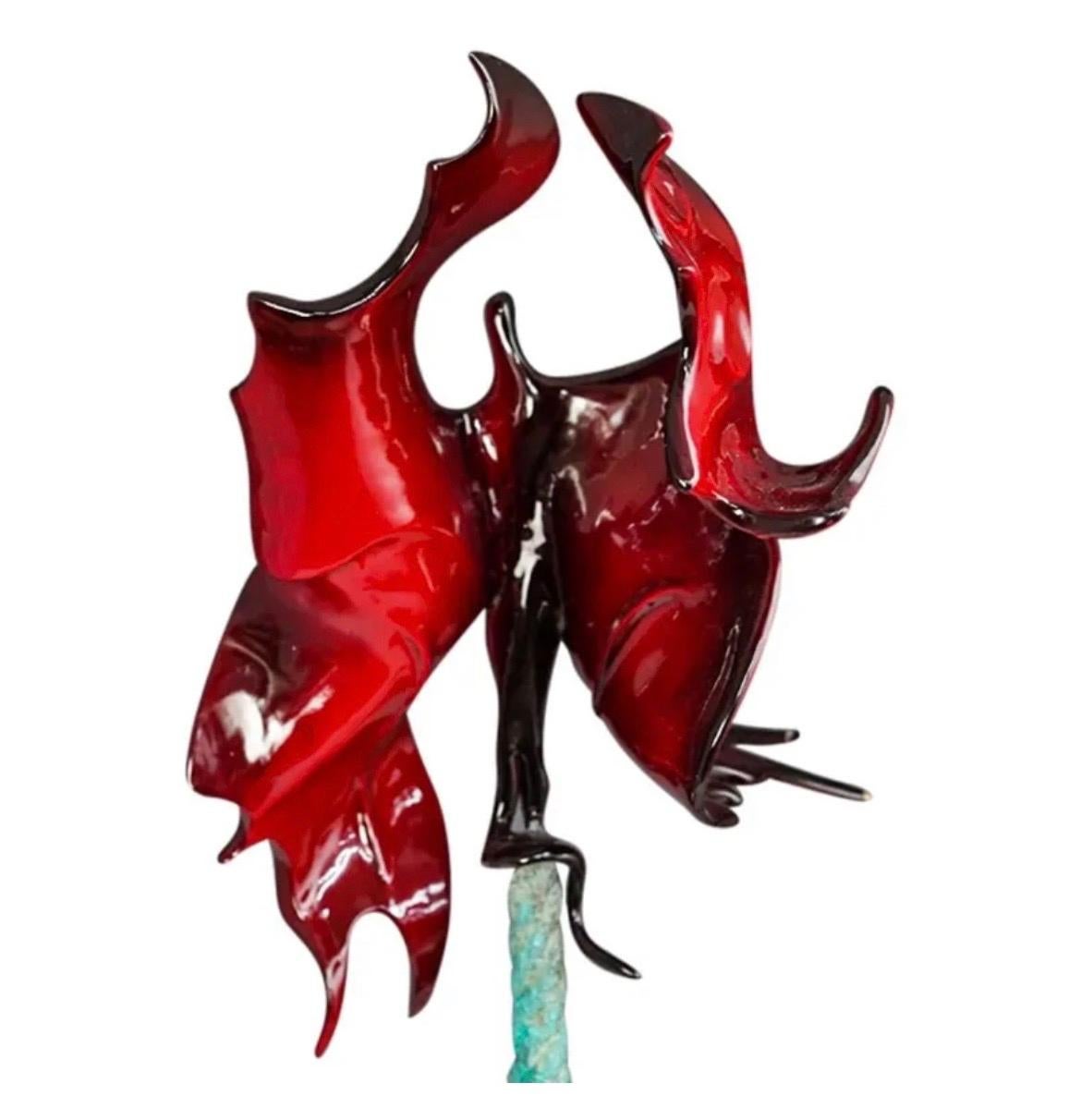Gadi Fraiman (Israel, 1958-) 
A figural metal sculpture depicting a rope with ascending angelic butterfly like creatures with a human or angel body and fluttering wings. This large metal sculpture is finished with a green and burgundy enamel patina