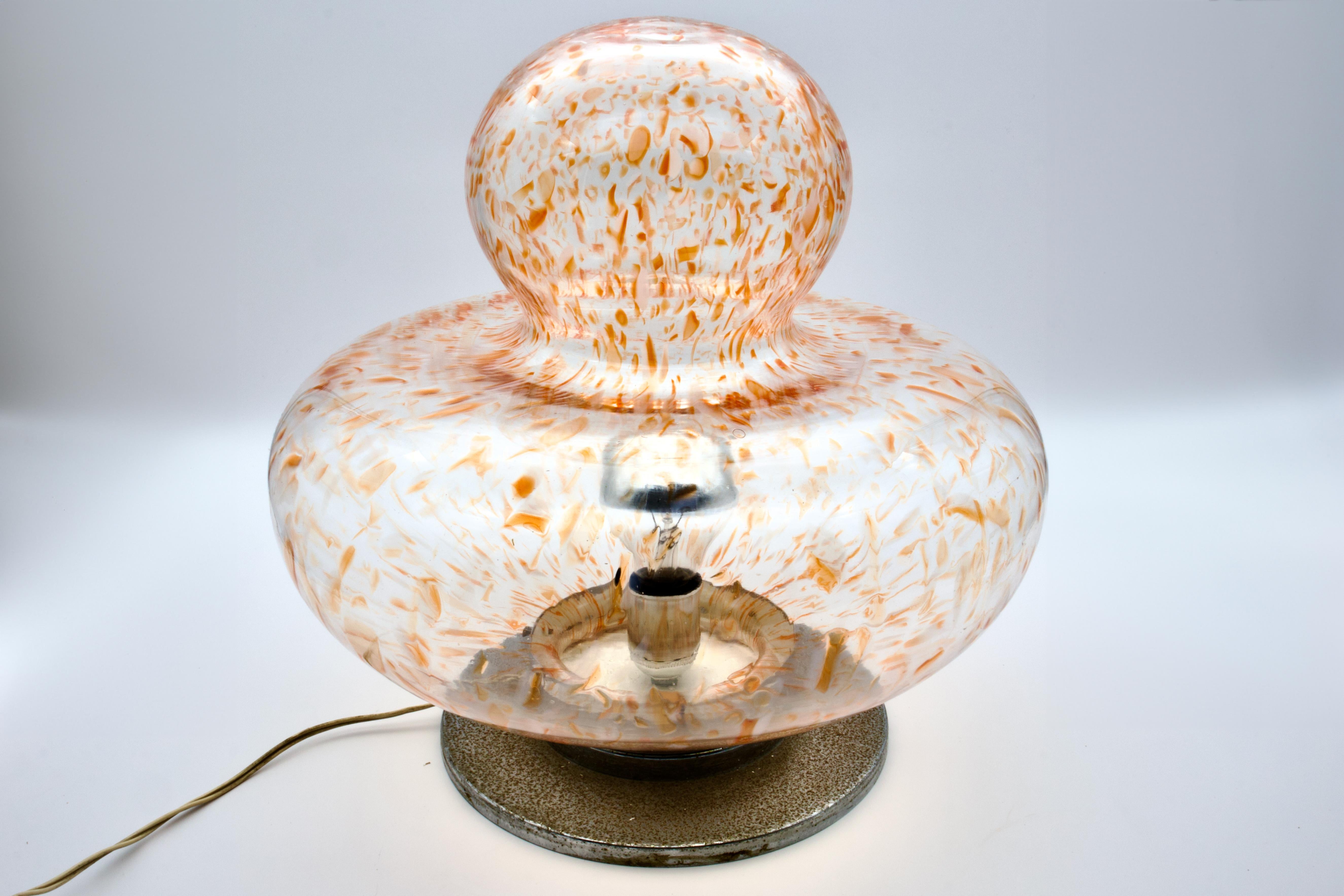 Delight in the artisanal charm of this handcrafted 1970s floor lamp, a treasure from the renowned isle of Murano. Celebrated for its glassmaking heritage, Murano glass is the medium of this exquisite 1970s piece, reminiscent of the artistic flair of