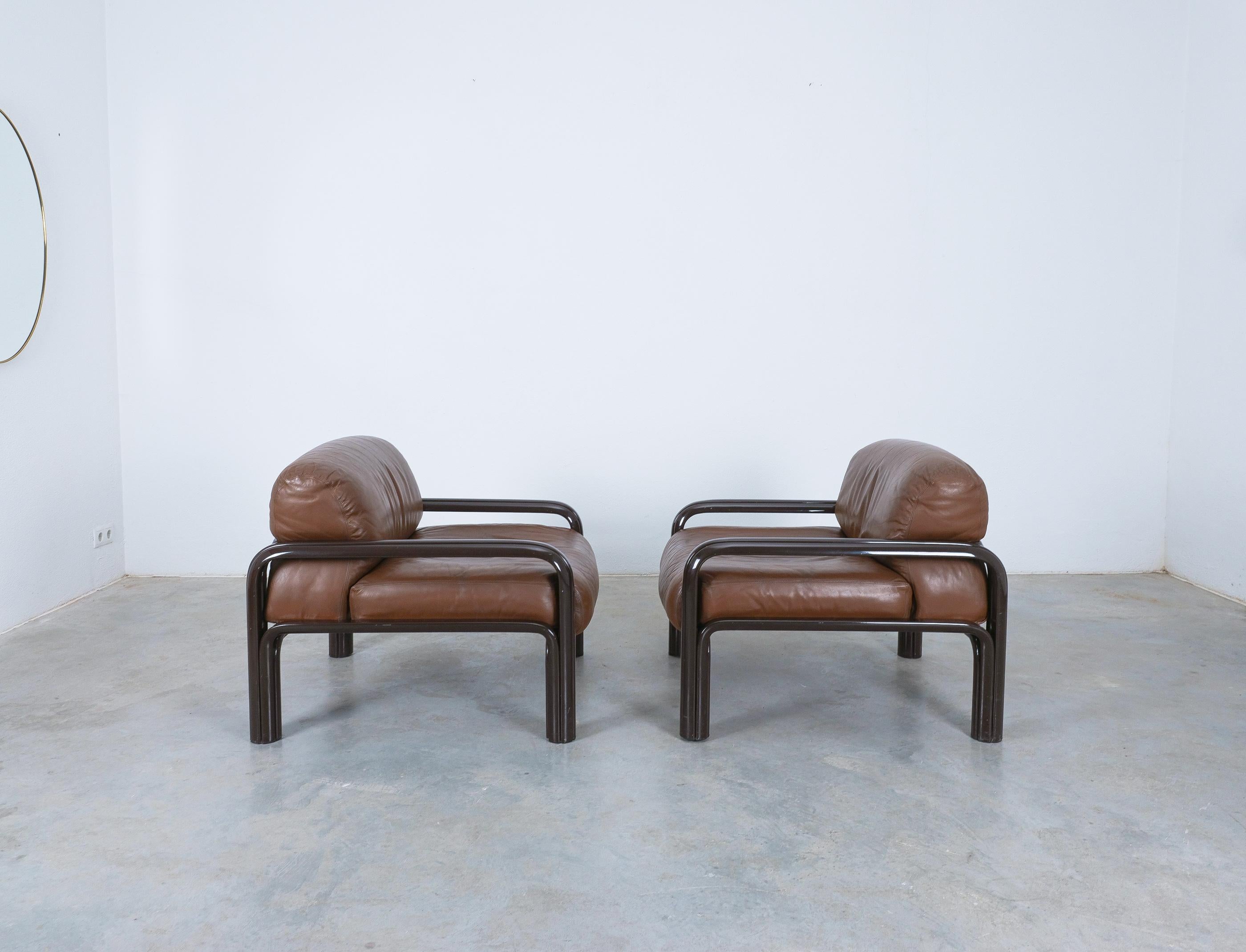 Collectors set of two Gae Aulenti for Knoll International lounge chairs-Priced as a pair

This set of two lounge armchairs is constructed of dark brown lacquered steel frames with the original brown leather cushions. Deep and wide seats provide