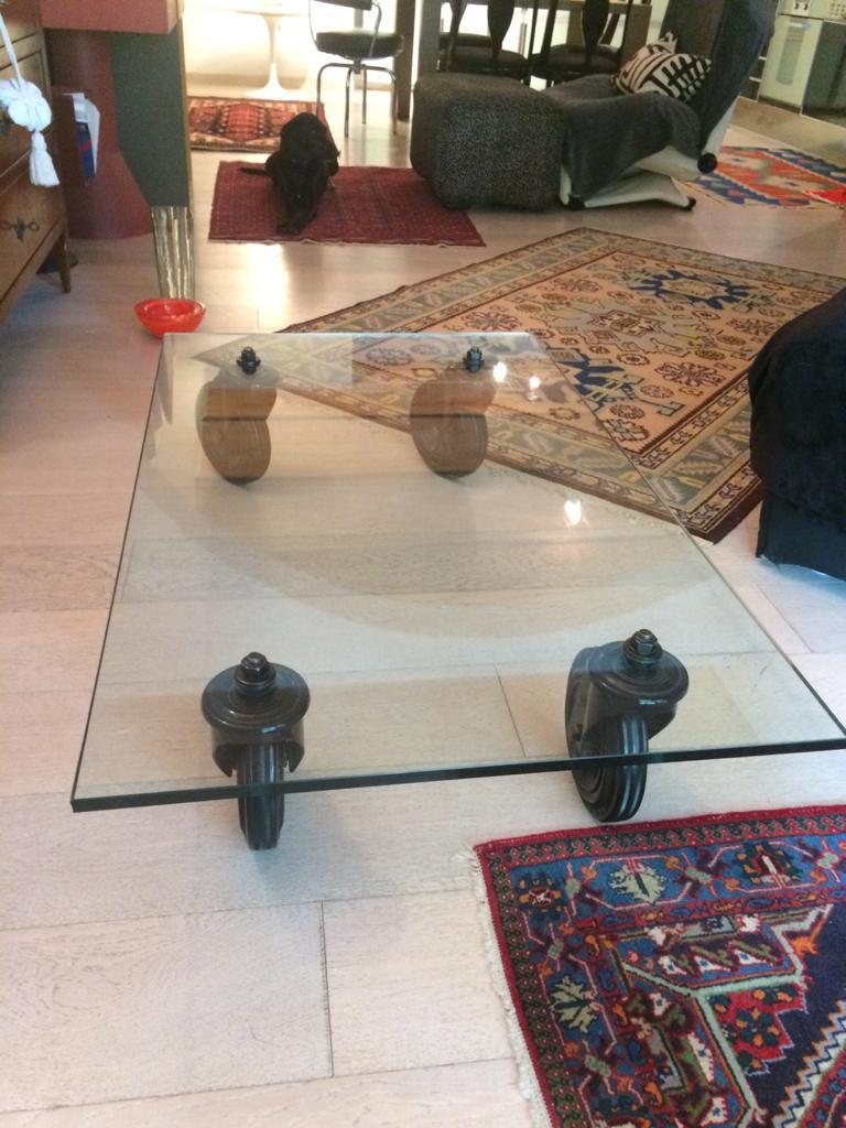 Gae Aulenti coffee table from Fontana Arte crystal top and stems wheels .This iconic coffee table has been ordered to Fontana Arte to measure according to the production standard.
Gae Aulenti was one of the most important and famous Italian