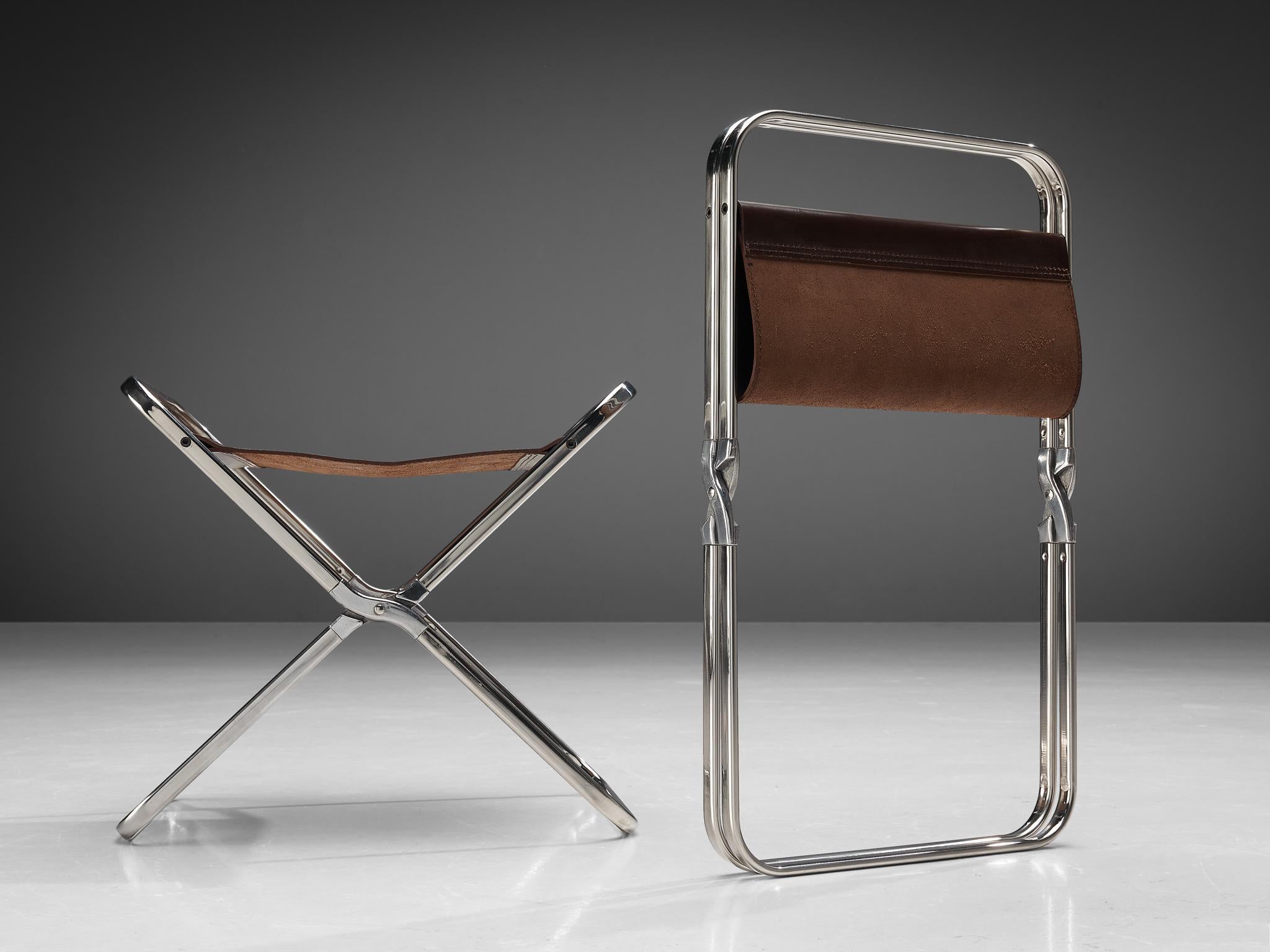 Gae Aulenti for Zanotta, folding stools, stainless steel, aluminum, saddle leather, Italy, 1964

Innovative and multifunctional pair of folding stools, model 'April', designed by Gae Aulenti. The foldable stool is made of stainless steel with a
