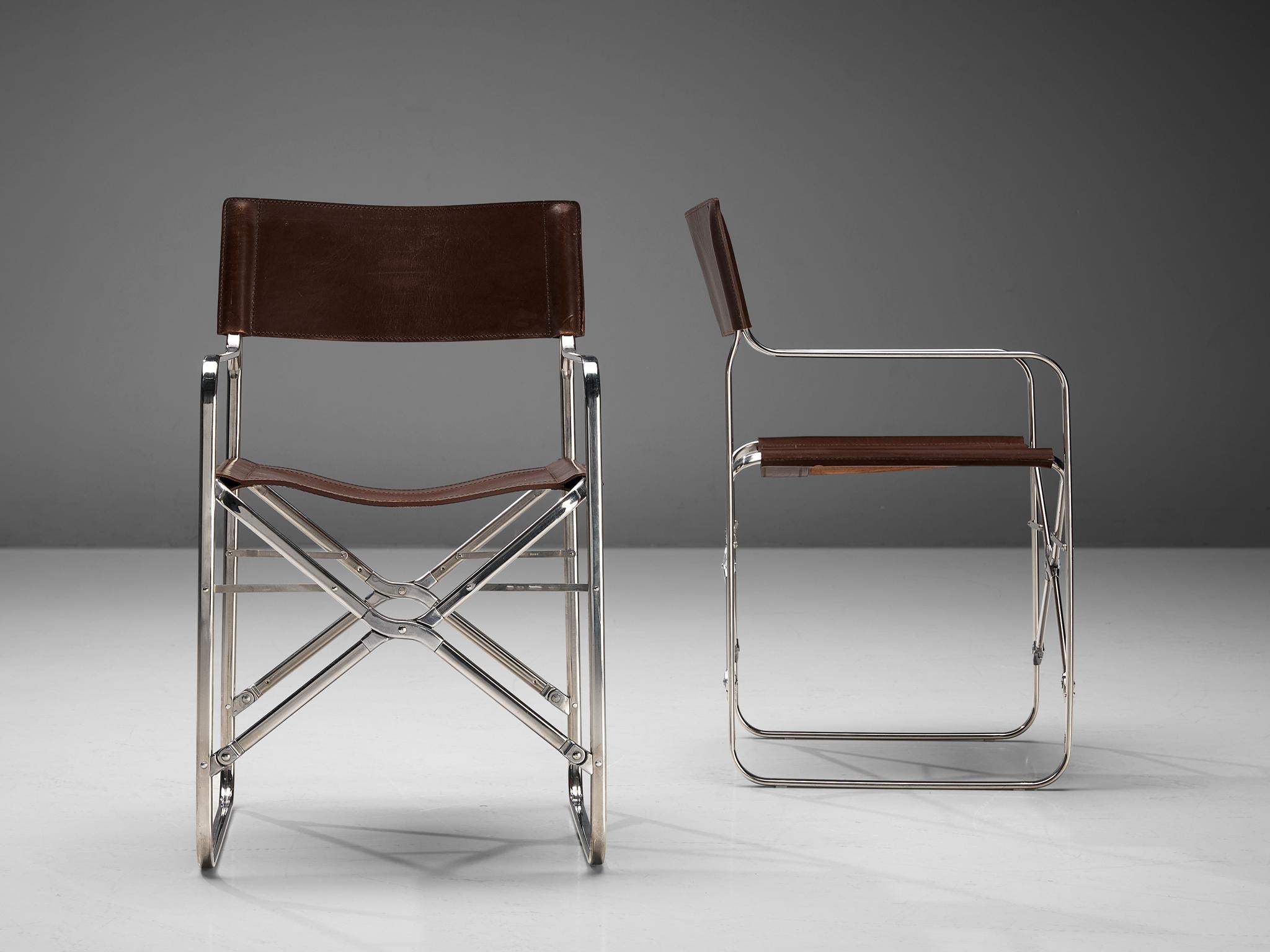 Gae Aulenti for Zanotta, folding chairs, stainless steel, aluminum, saddle leather, Italy, 1964

Gae Aulenti transformed the idea of a classic directors chair in to an innovative and multifunctional chair with this model called 'April'. These