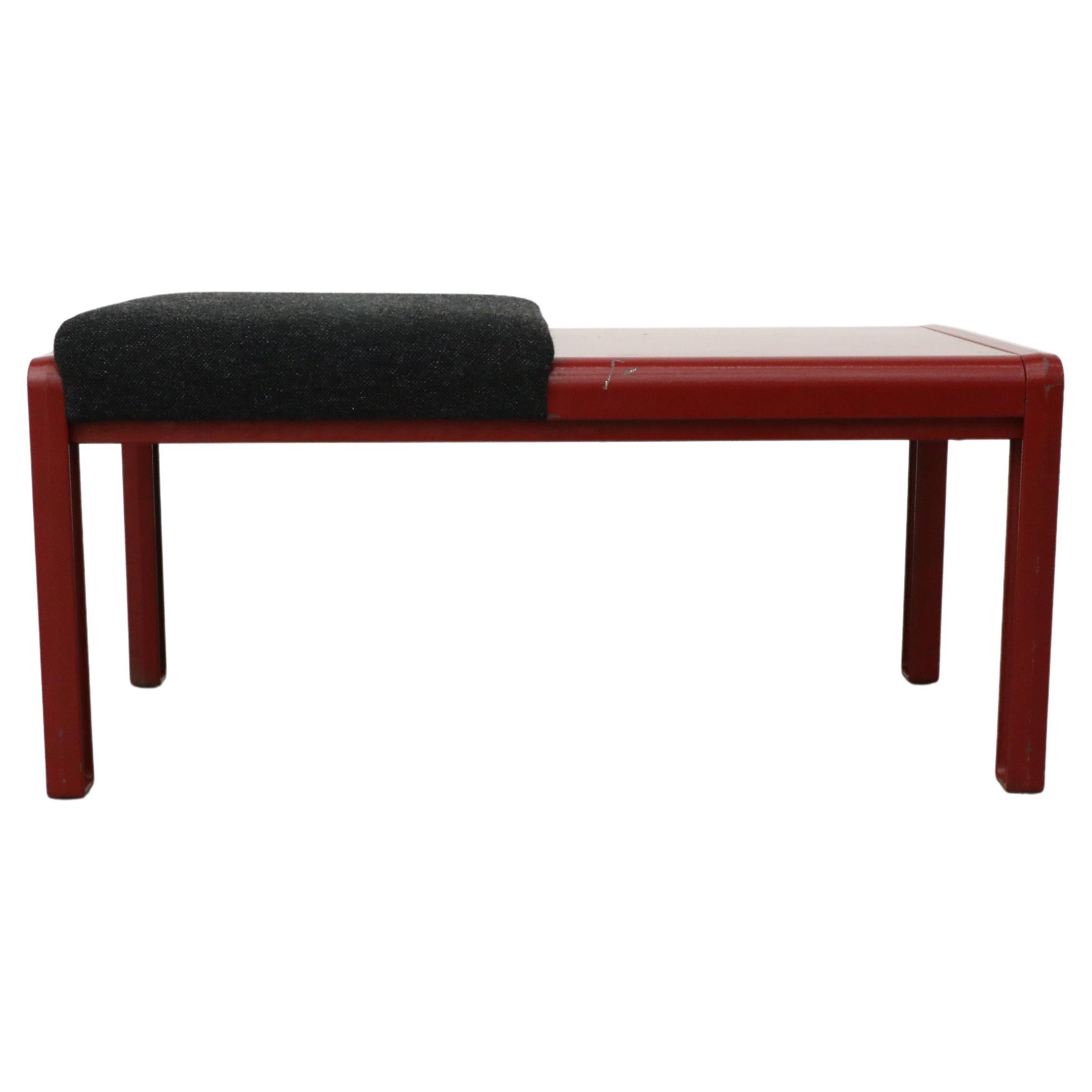 Kembo manufactured, Dutch Mid-Century red enameled metal bench with dark gray cushion and accompanying side table. Kembo,  founded in 1953 by 