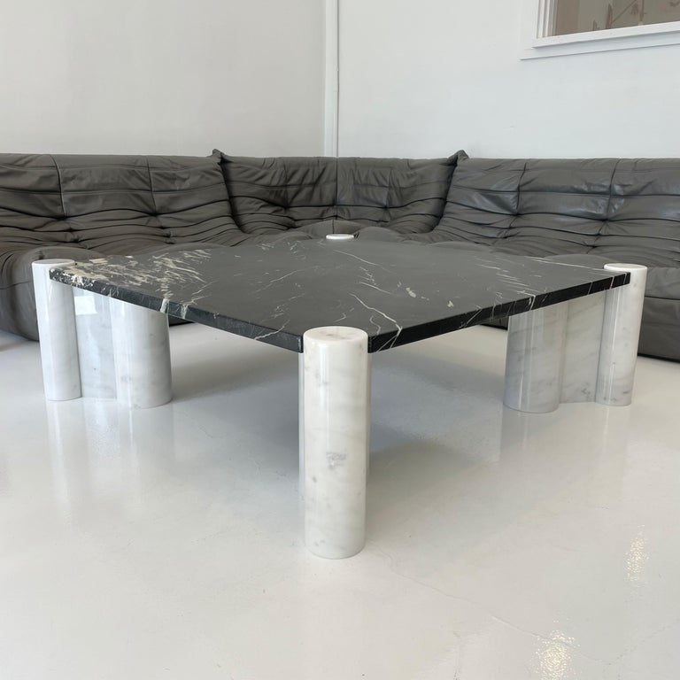 Early Carrara marble table by Gae Aulenti for Knoll. Black top with white bases. Custom order in the 1960s. Extremely rare design. Great vintage condition. Original Knoll stickers.