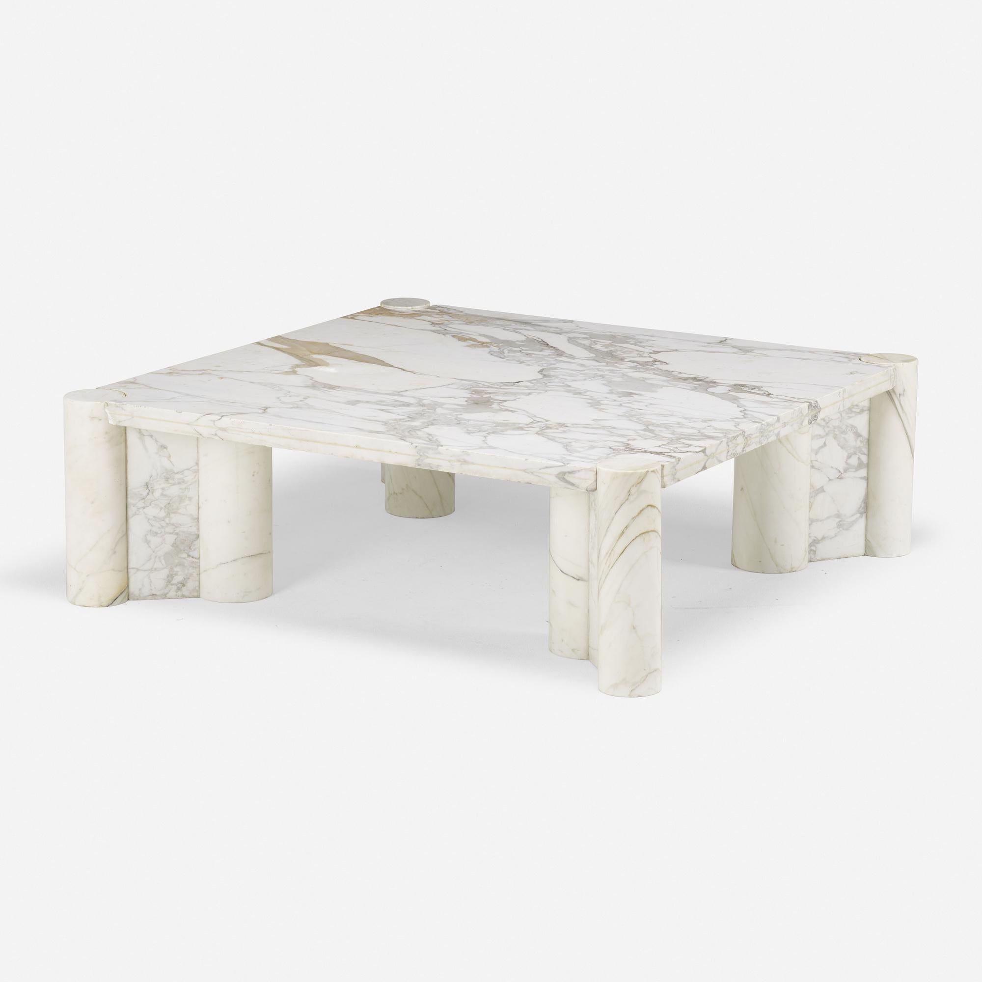 Gae Aulenti 'Jumbo' coffee table. Carved of polished Calacatta Gold marble. Designed in 1964 and made by Knoll. Features cluster legs and is known for its graceful forms and opulent strength. Wear consistent with use over time, including several