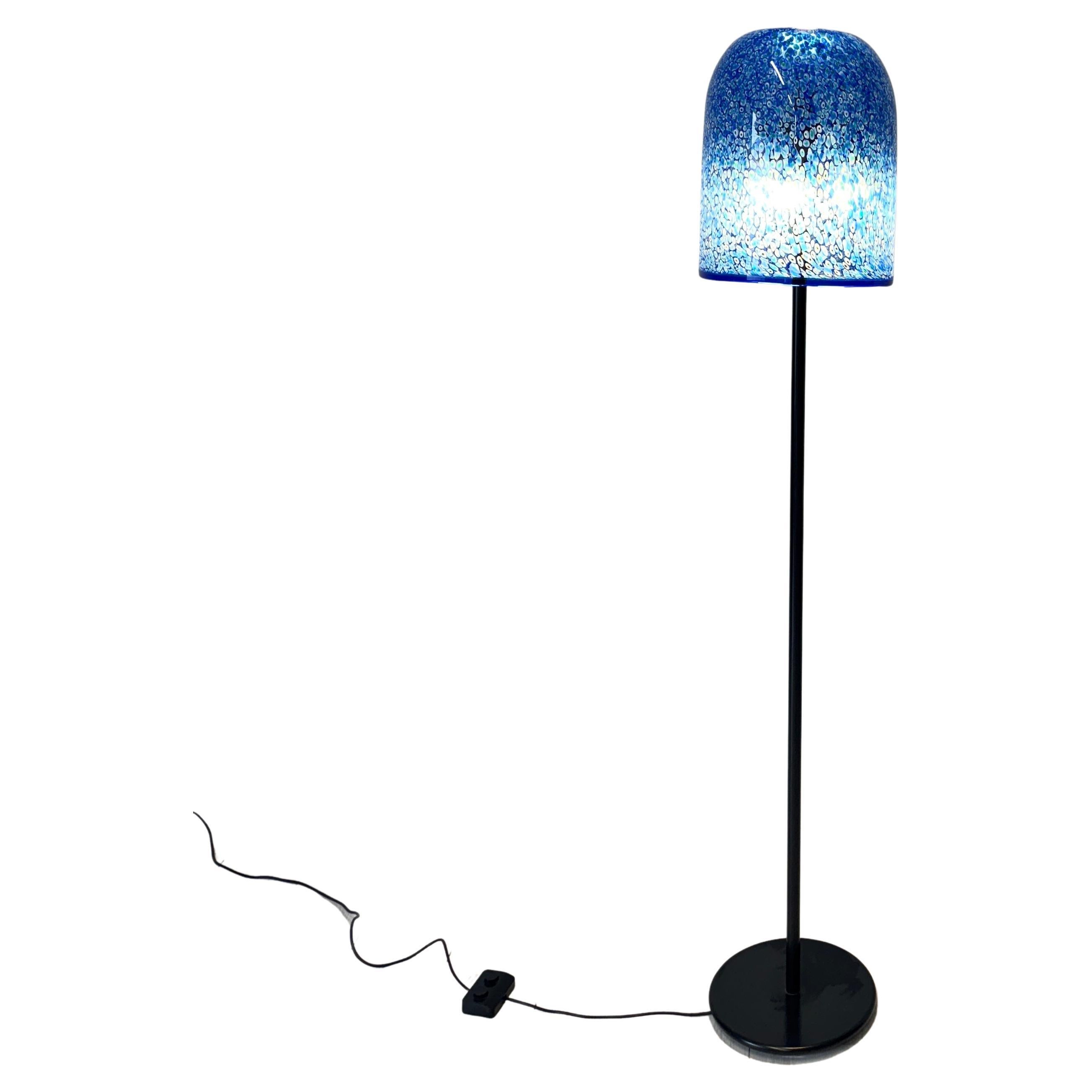 Beautiful floor lamp produced by Vistosi since 1976 designed by architect Gae Aulenti.
Murrine glass lampshade, painted metal stand

Engraved signature 