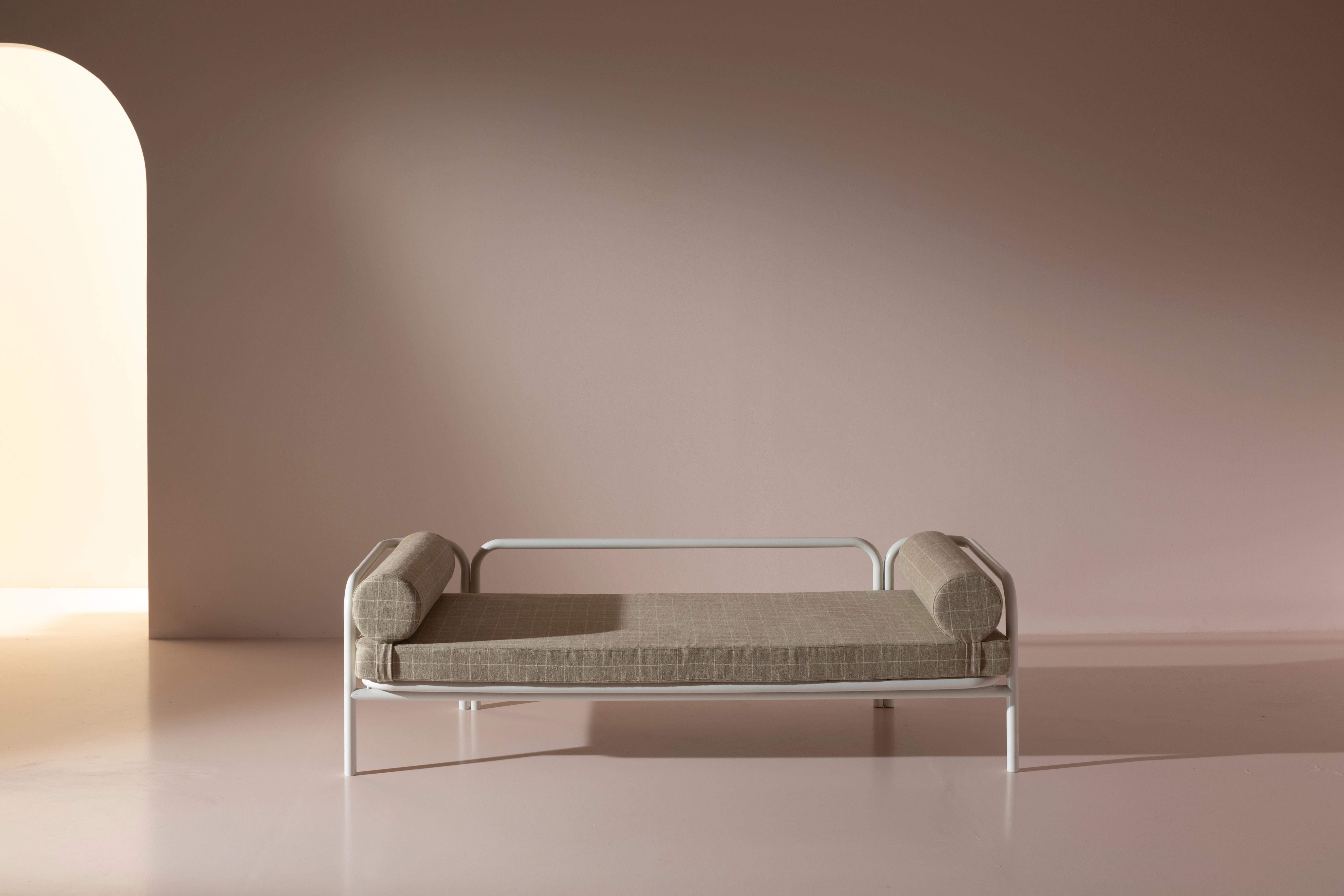 Tubular metal daybed, model Locus Solus, designed by Gae Aulenti, produced by Poltronova in 1964.

A painted metal tube unpredictably bends and takes the form of a daybed, as if sketched by a continuous, unbroken line of a pencil moving across a