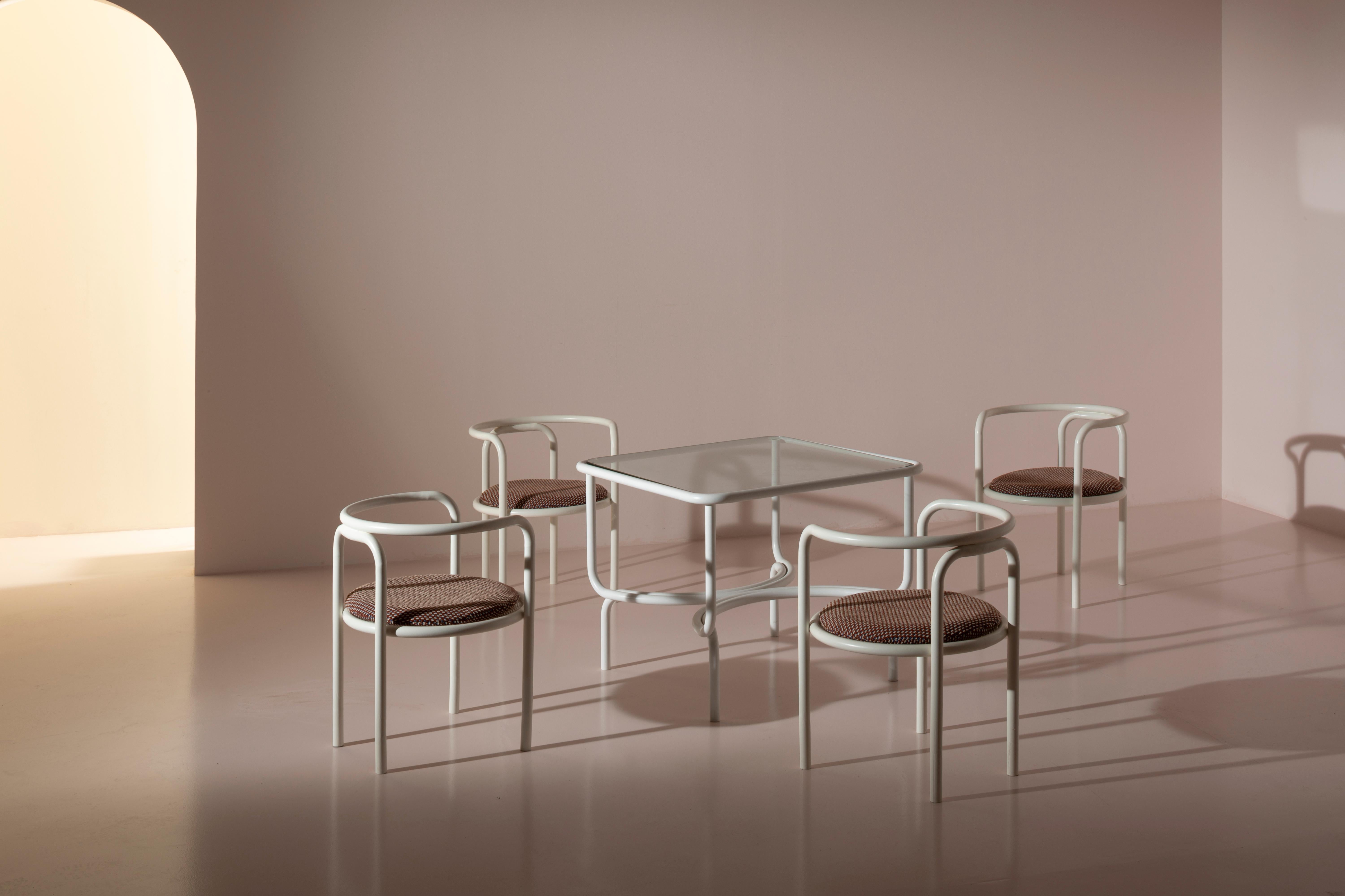 Tubular metal garden set consisting of a table and four armchairs, model Locus Solus, designed by Gae Aulenti, produced by Poltronova in 1964.

A painted metal tube unpredictably bends and takes the form of tables, chairs, and armchairs, as if