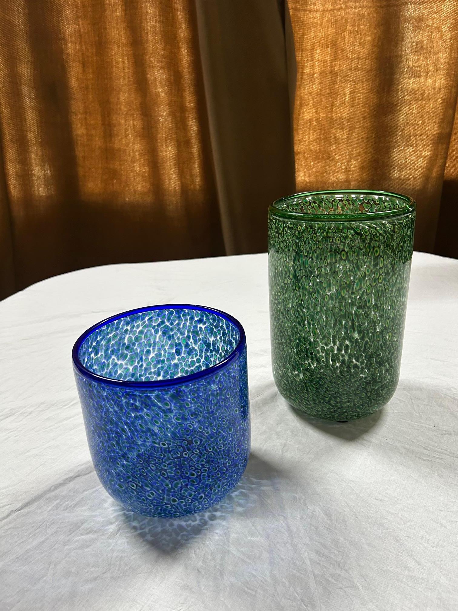 'Neverrino' series green and blue murrine-blown glass pair of vases designed by Gae Aulenti for Vetreria Vistos in the '70s.

19 cm H and 30 cm H / 18 cm diam.

Conditions: excellent, no defects. In working conditions.