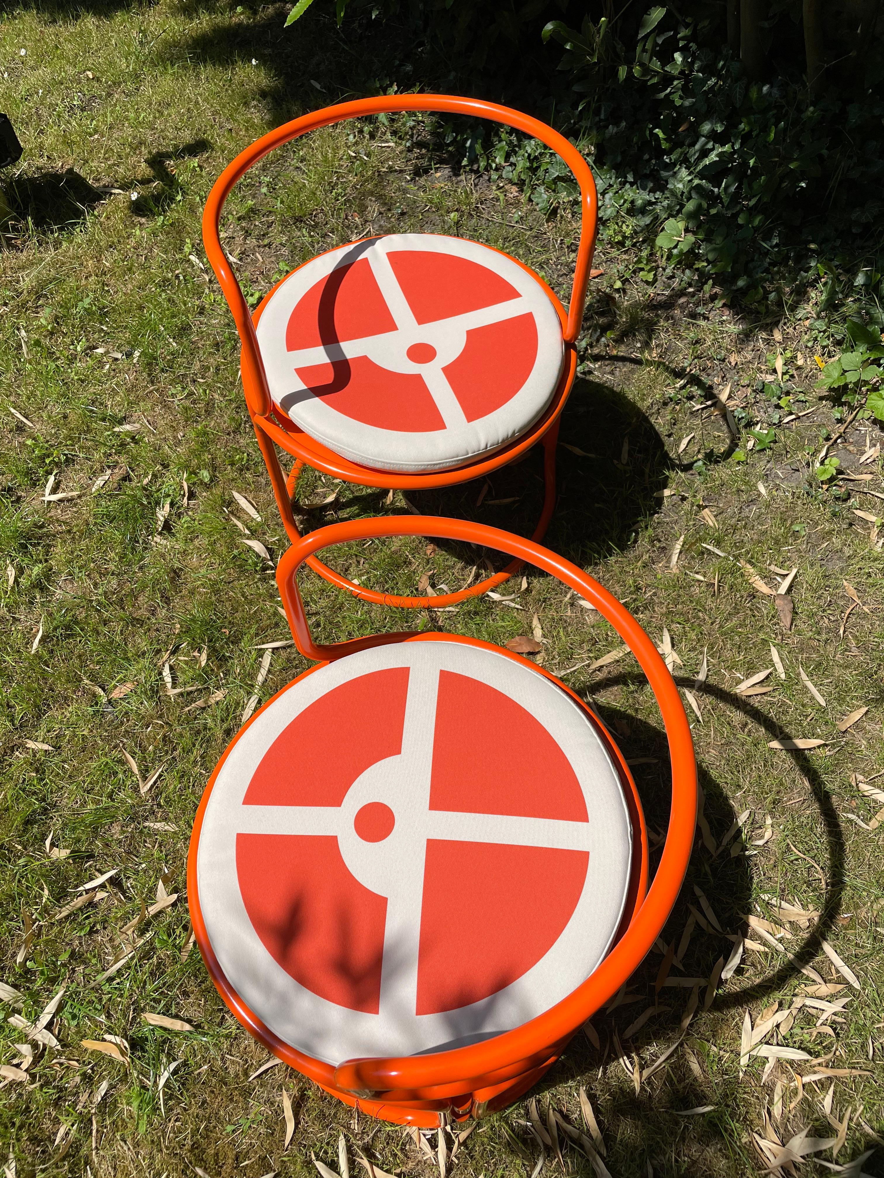 Steel Gae Aulenti, orange lacquered steel armchairs For Sale