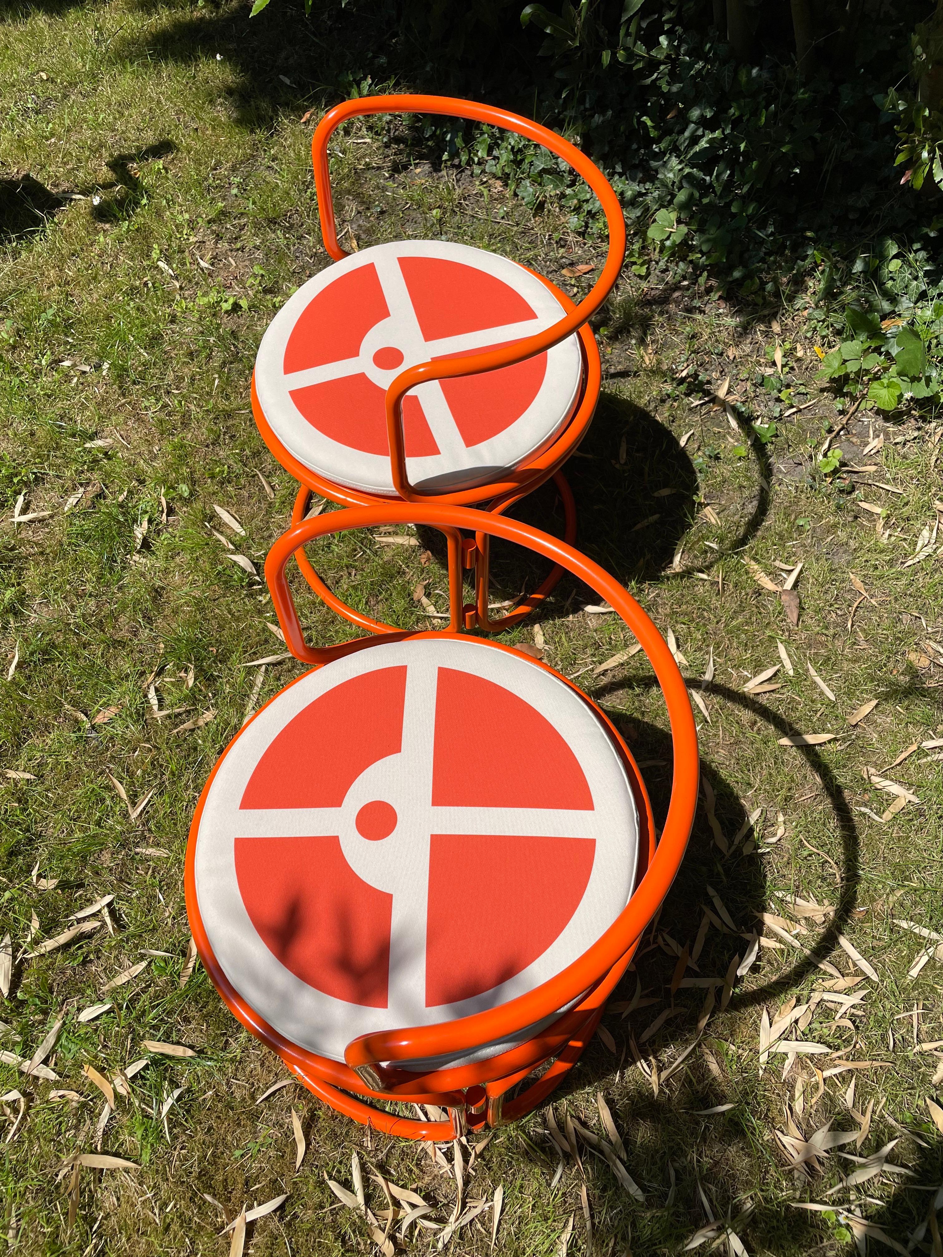 Gae Aulenti, orange lacquered steel armchairs For Sale 1
