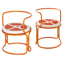Gae Aulenti, orange lacquered steel armchairs