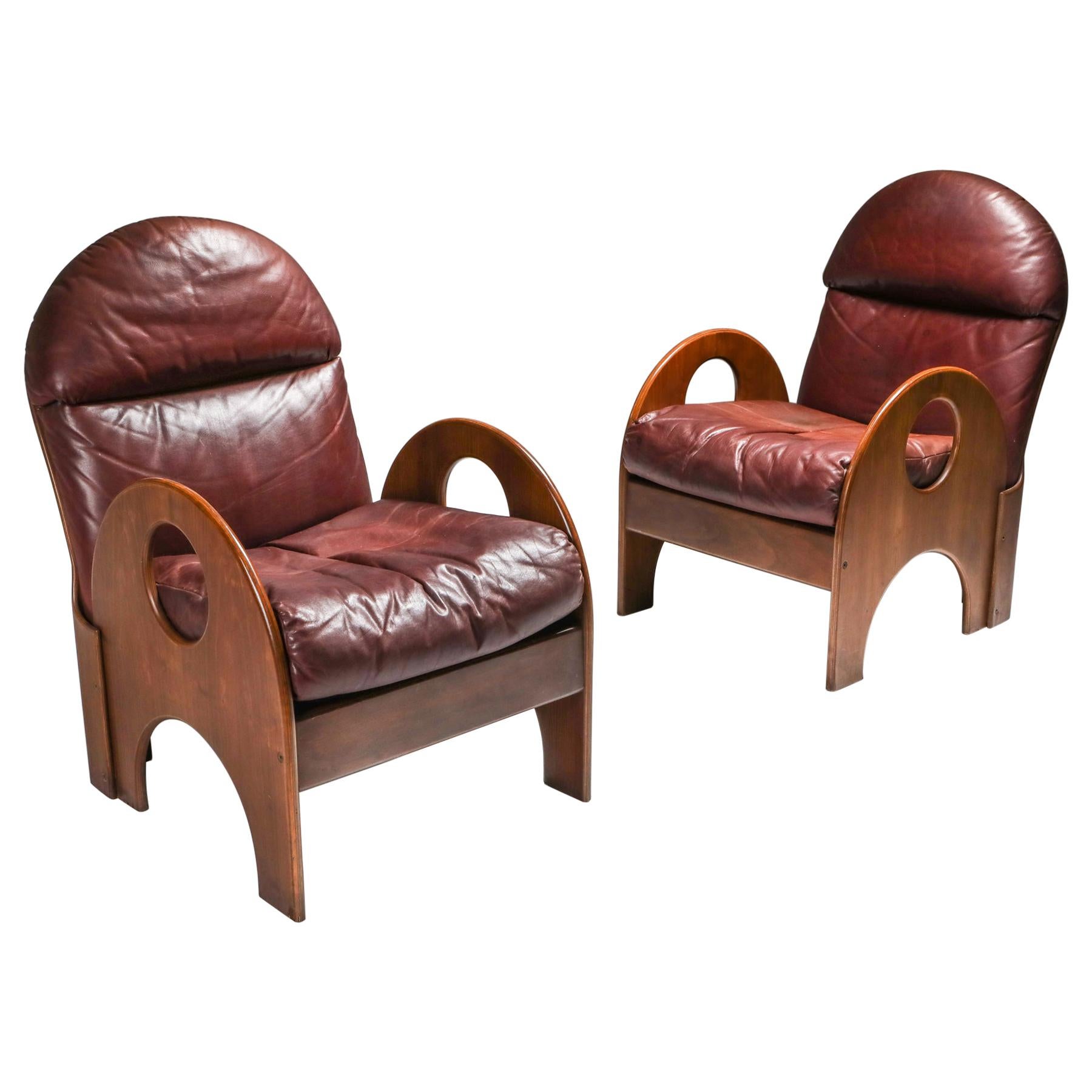 Gae Aulenti Pair of "Arcata" Easy Chairs in Walnut and Burgundy Leather