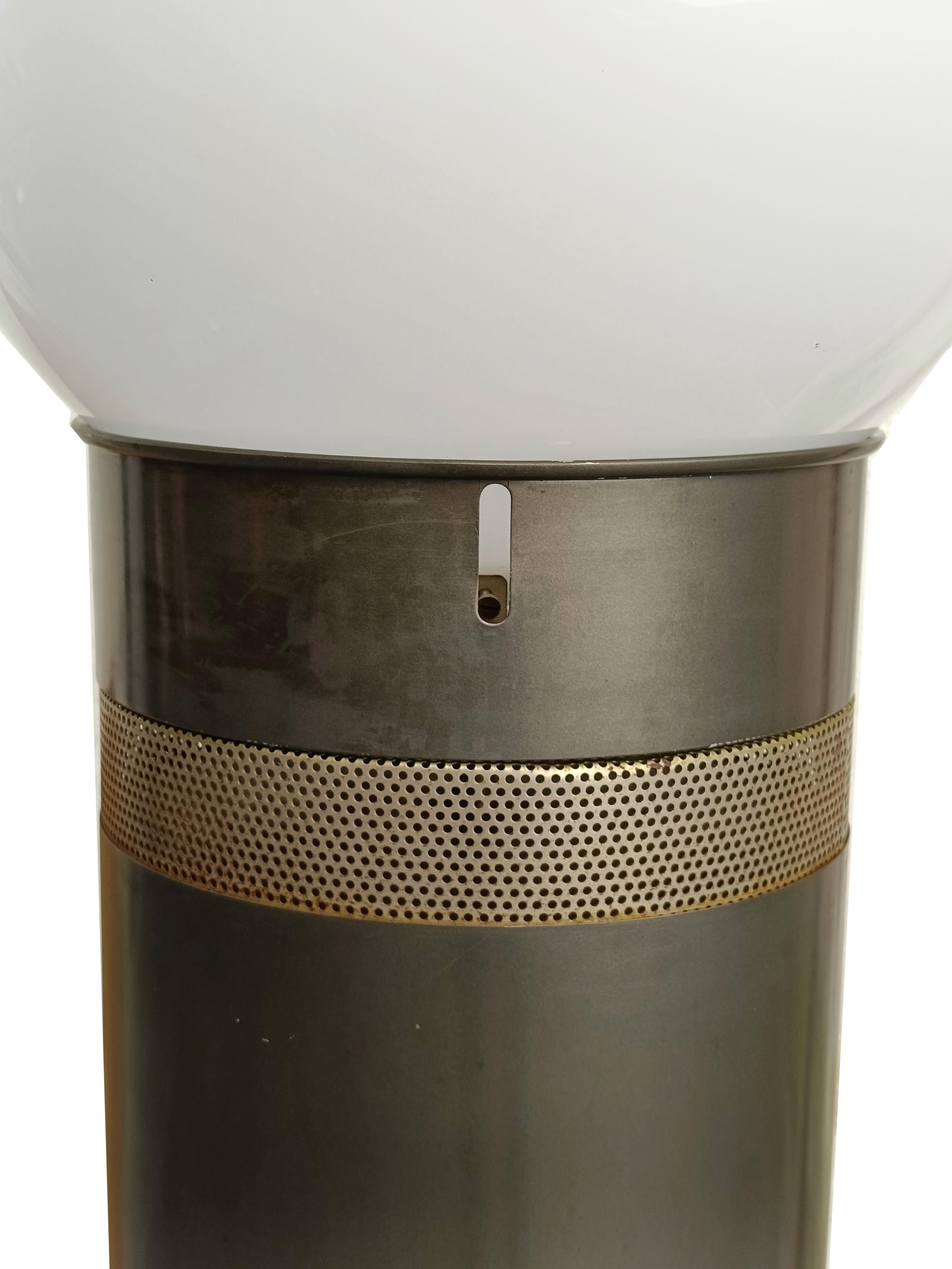 Gae Aulenti  Floor lamp Oracolo model. Production Artemide, Milan, 1969. Tubular frame made of gray painted metal and perforated steel, large globe lampshade made of lacquered glass.