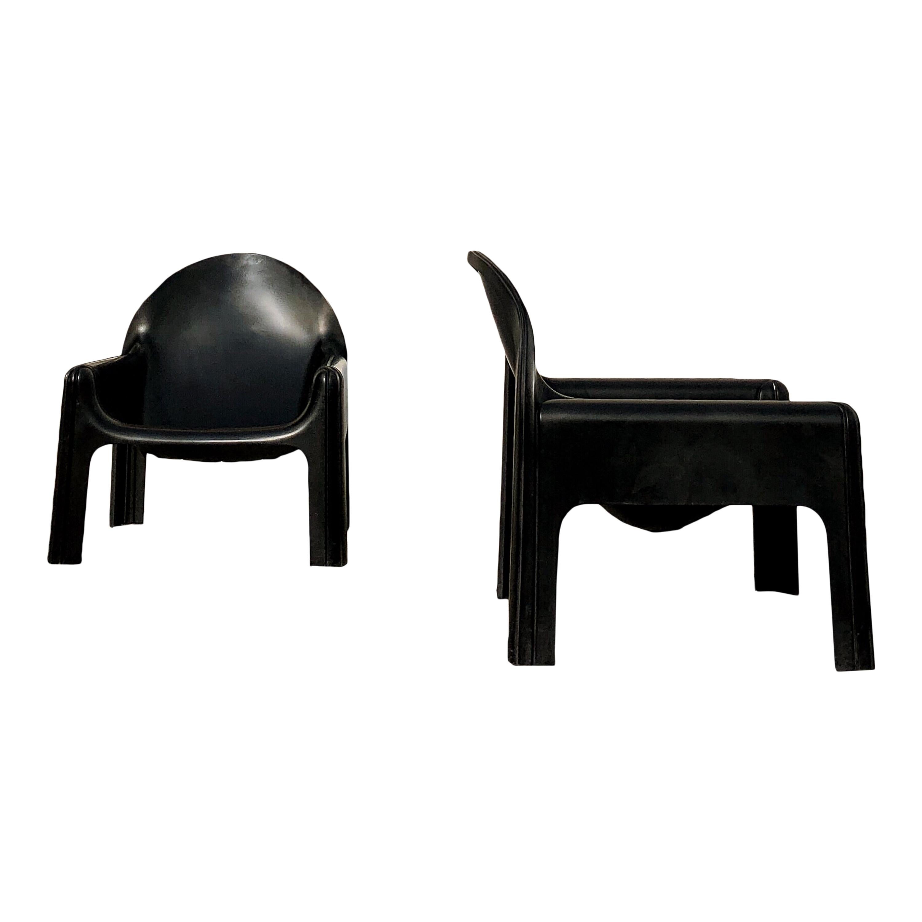 Rare pair of Italian lounge chairs 4794 by Gae Aulenti for Kartell, 1974.
This is the version in black which is hard to find. Molded black lacquered polyurethane.
In good original condition with minor wear consistent with age and use, preserving a