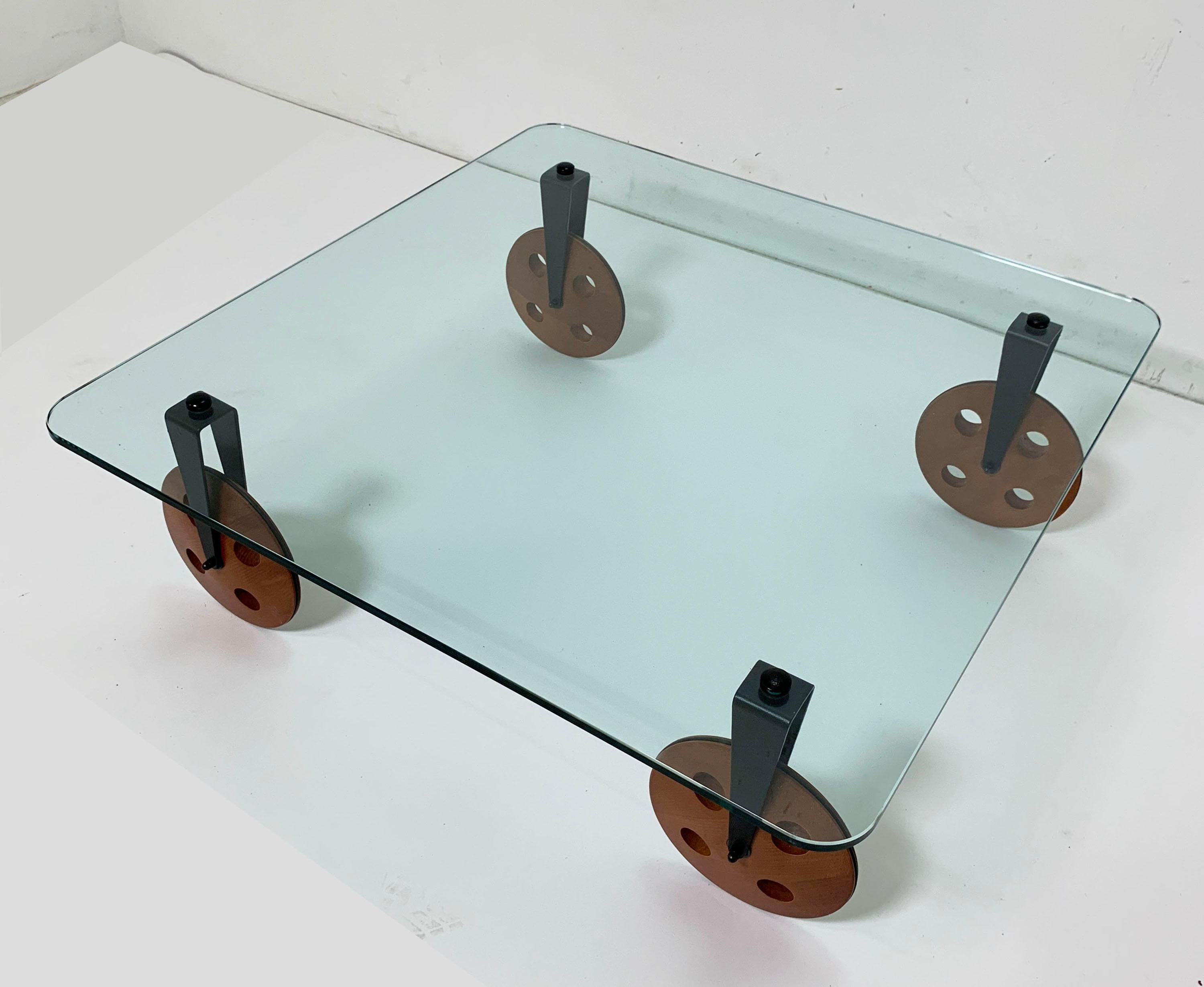 When the Italian architect Gae Aulenti introduced her iconic glass topped “Tavolo Con Ruote” coffee table in 1980, it created a design sensation that helped define the Postmodern age. The rubber wheeled version she devised for Fontana Arte spawned a