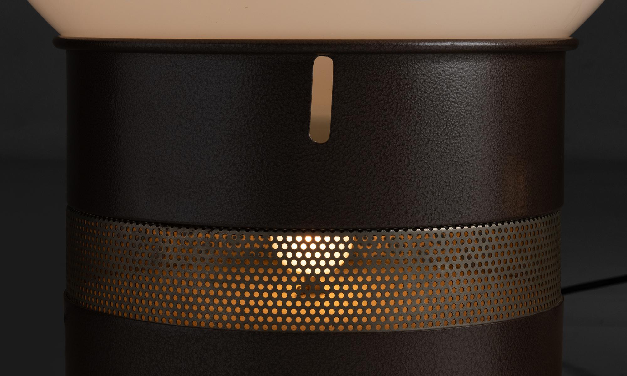 Gae Aulenti Table Lamps

Italy circa 1960

Oracolo table lamp, Opaline globe on enameled aluminum tubular base with perforated steel band.

21”dia x 25”h