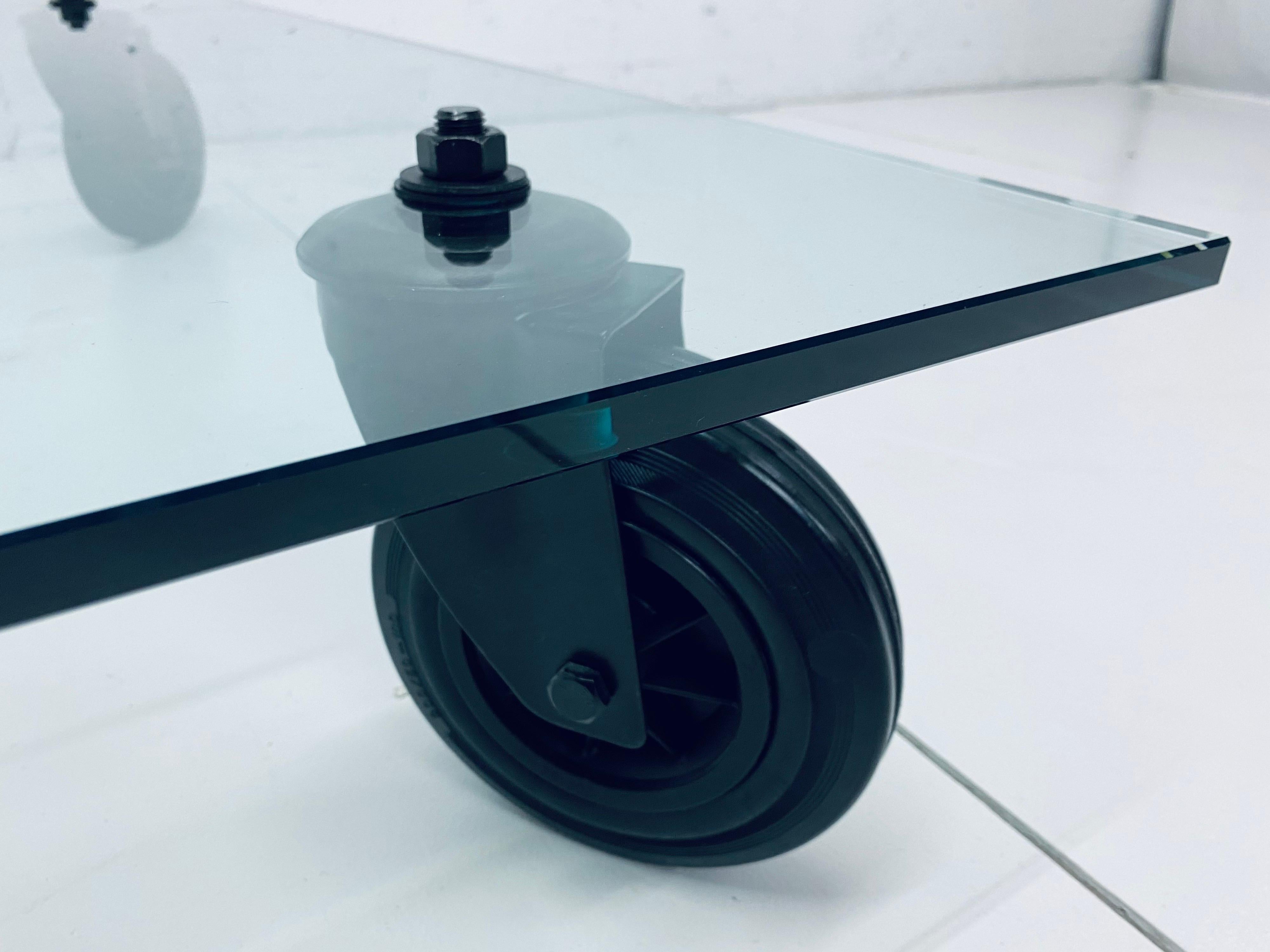 Contemporary Gae Aulenti Tavolo Con Ruote Low Glass Coffee Table on Casters for Fontana Arte