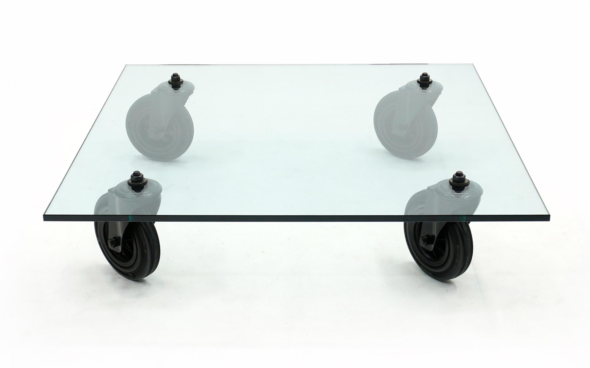 Tavolo Con Ruote coffee table designed by Gae Aulenti for Fontana Arte, Italy, 1980. The tempered glass is slightly over 1/2 inch thick and almost 40 inches square. Extremely high quality build. No chips or significant scratches to the glass.