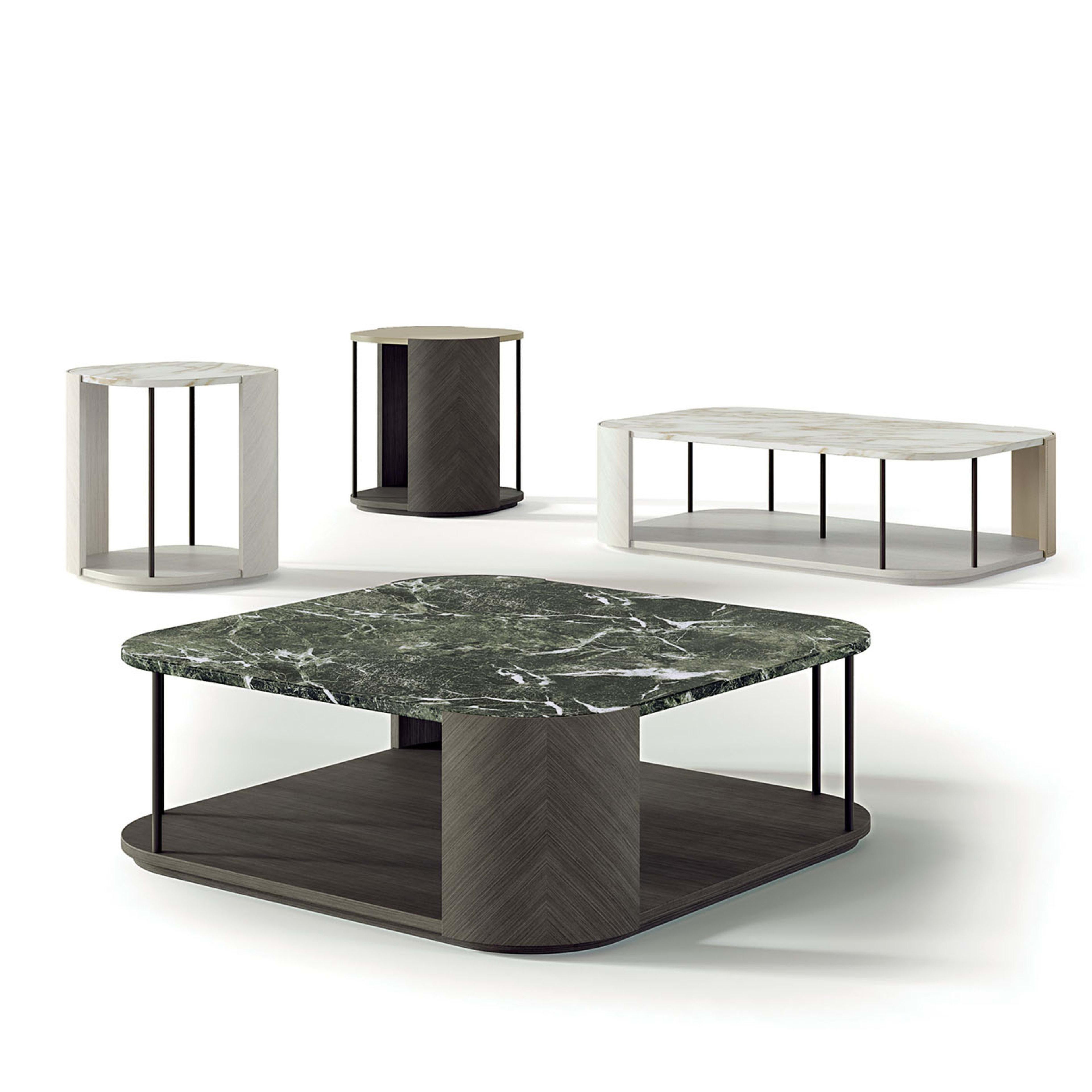 Coffee tables inspired by the Gae bookcase. The curved elements are in light Tay with a gold Calacatta marble top. Metal supports are in bronze-gold finish.