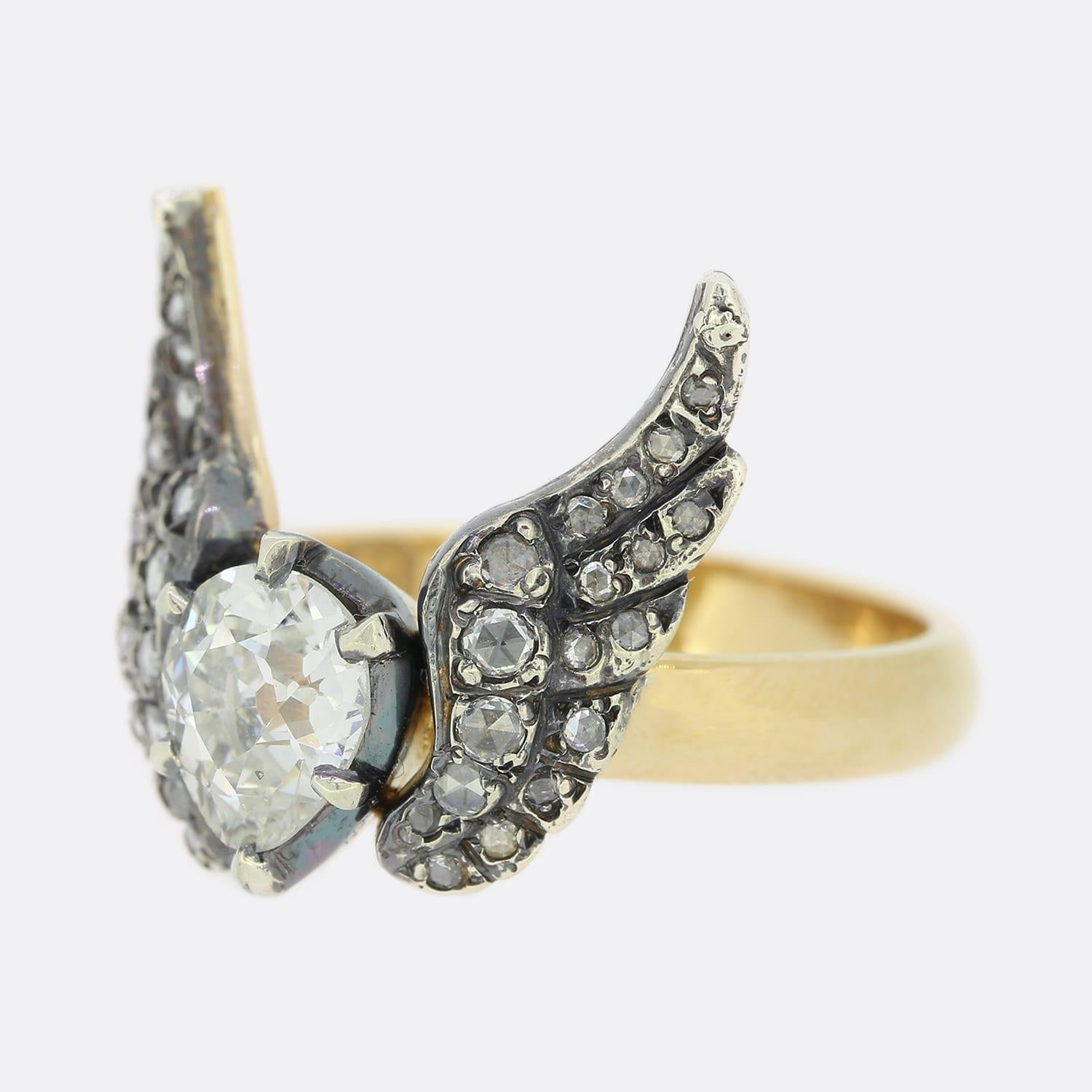 This is a truly wonderful ring masterfully brought to life by the world-renowned antique jewellery re-designer Gaetano Chiavetta. The ring is handcrafted in 18ct yellow gold and silver and features rose cut diamond set wings with a large diamond set