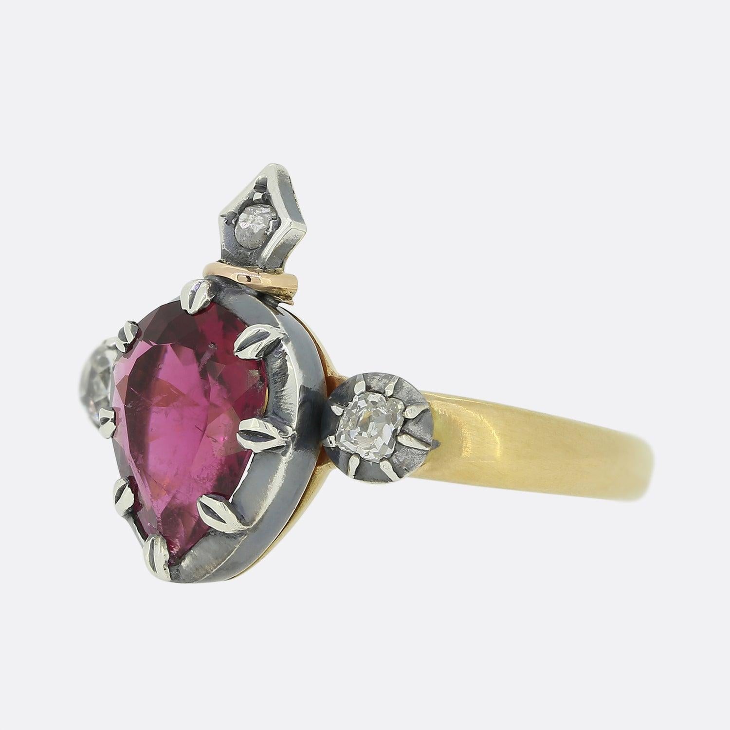 Here we have a beautiful rubellite and diamond ring. The setting of the ring is in a Georgian style and features a centralised pear shaped rubellite which is flanked by two old cut diamonds on either side and a single matching stone atop. The