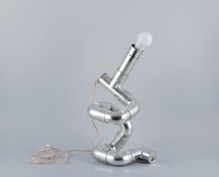 Gaetano Missaglia, Italian designer. Rombo table lamp composed of pipes.