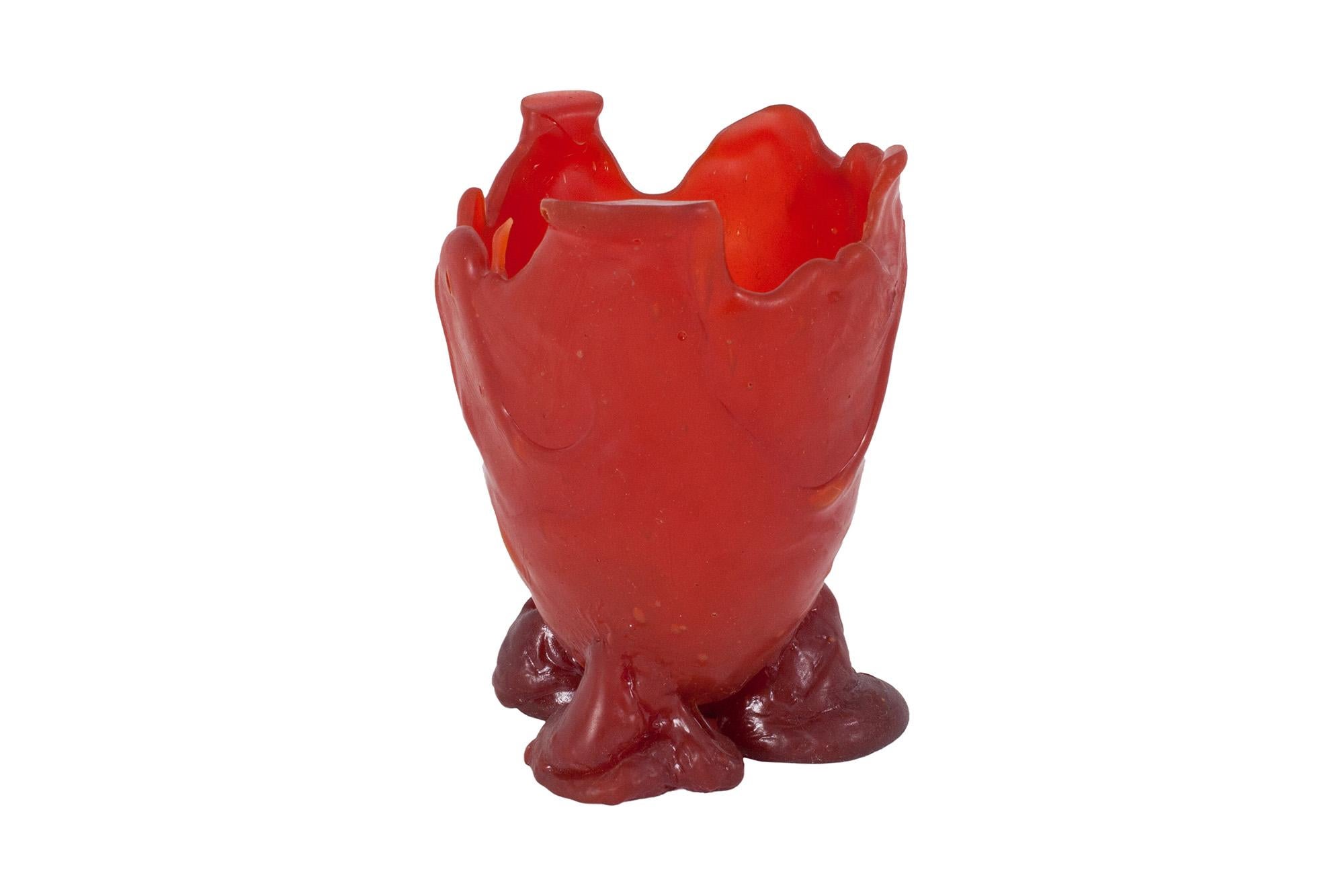 Resin vase designed by architect / designer Gaetano Pesce. The vessel stands on three small legs. The body of the vessel is created by different casted layers of resin in bright red, creating a very beautiful and playful aesthetic appearance.