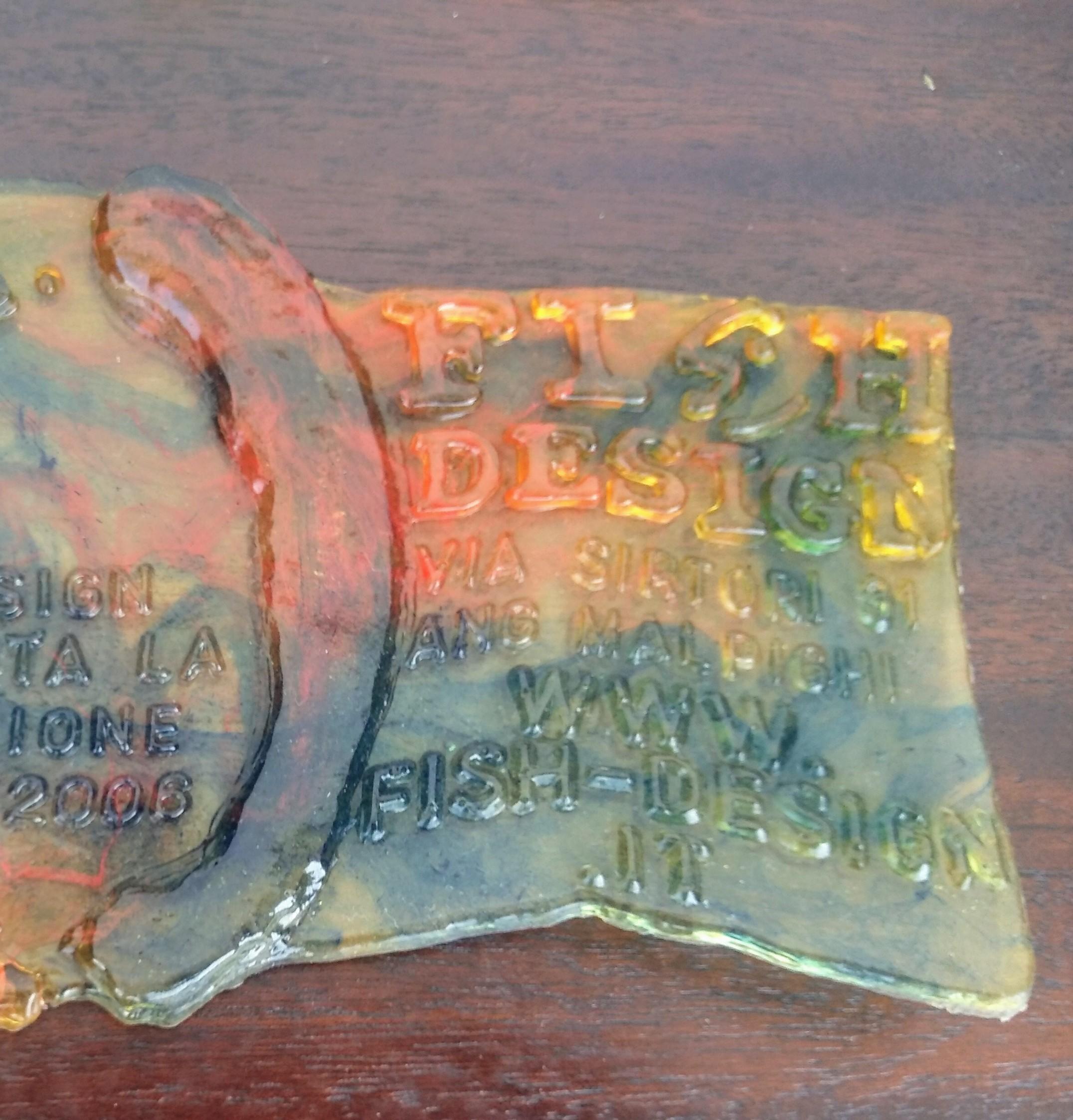 This is a Gaetano Pesce Exhibition Invitation. Made of a cast rubber, it contains the details of the exhibition.