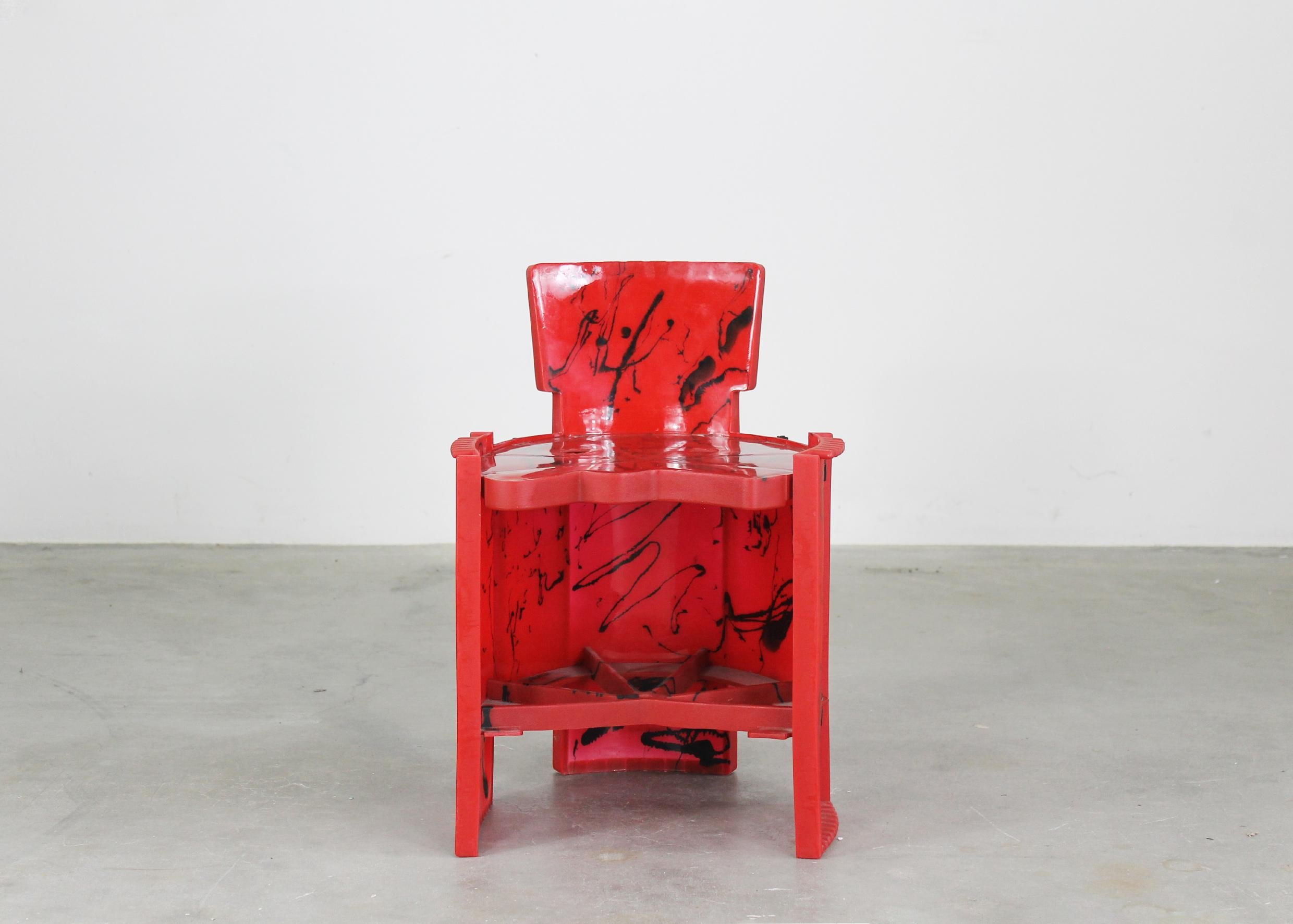Small chair in red and black resin from the Nobody's Perfect series designed by Gaetano Pesce and produced by Zerodisegno 2002. 

With the manufacturer's brand stamped on the back side.

Gaetano Pesce is a prominent contemporary Italian designer and