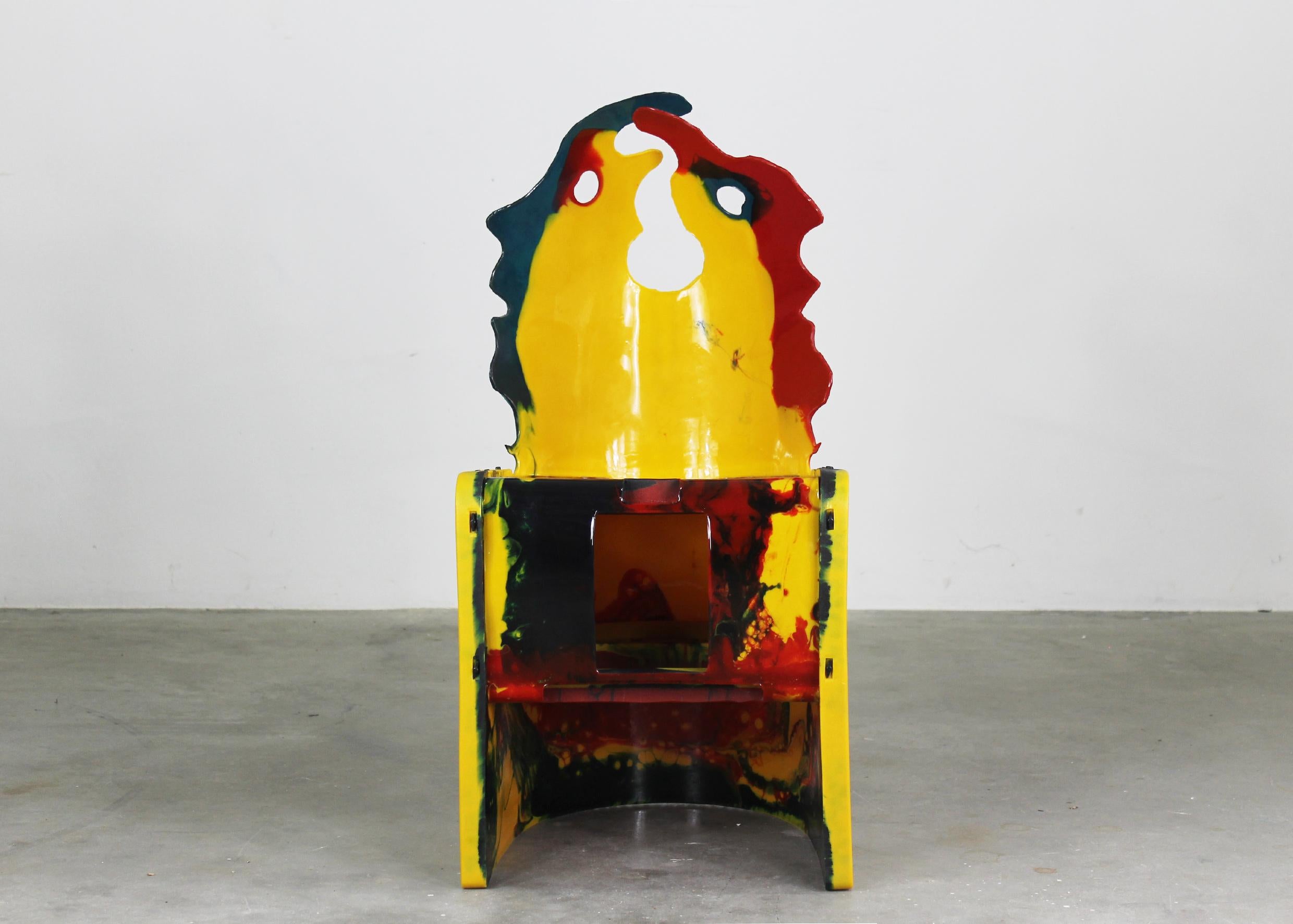 The Faces chair from the Nobody's Perfect series is in resin with plastic pegs, designed by Gaetano Pesce and produced by Zerodisegno 2005. 

With the manufacturer's brand stamped on the back-side.

Gaetano Pesce is a prominent contemporary Italian