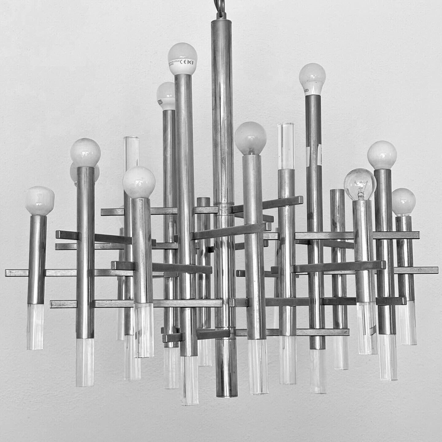 1970s - stunning and scenic chandelier designed by Gaetano Sciolari.

16 lights

All-chrome steel frame with acrylic details, adhesive present on top.

The item is in excellent conservative condition, there is no aesthetic or structural defect to