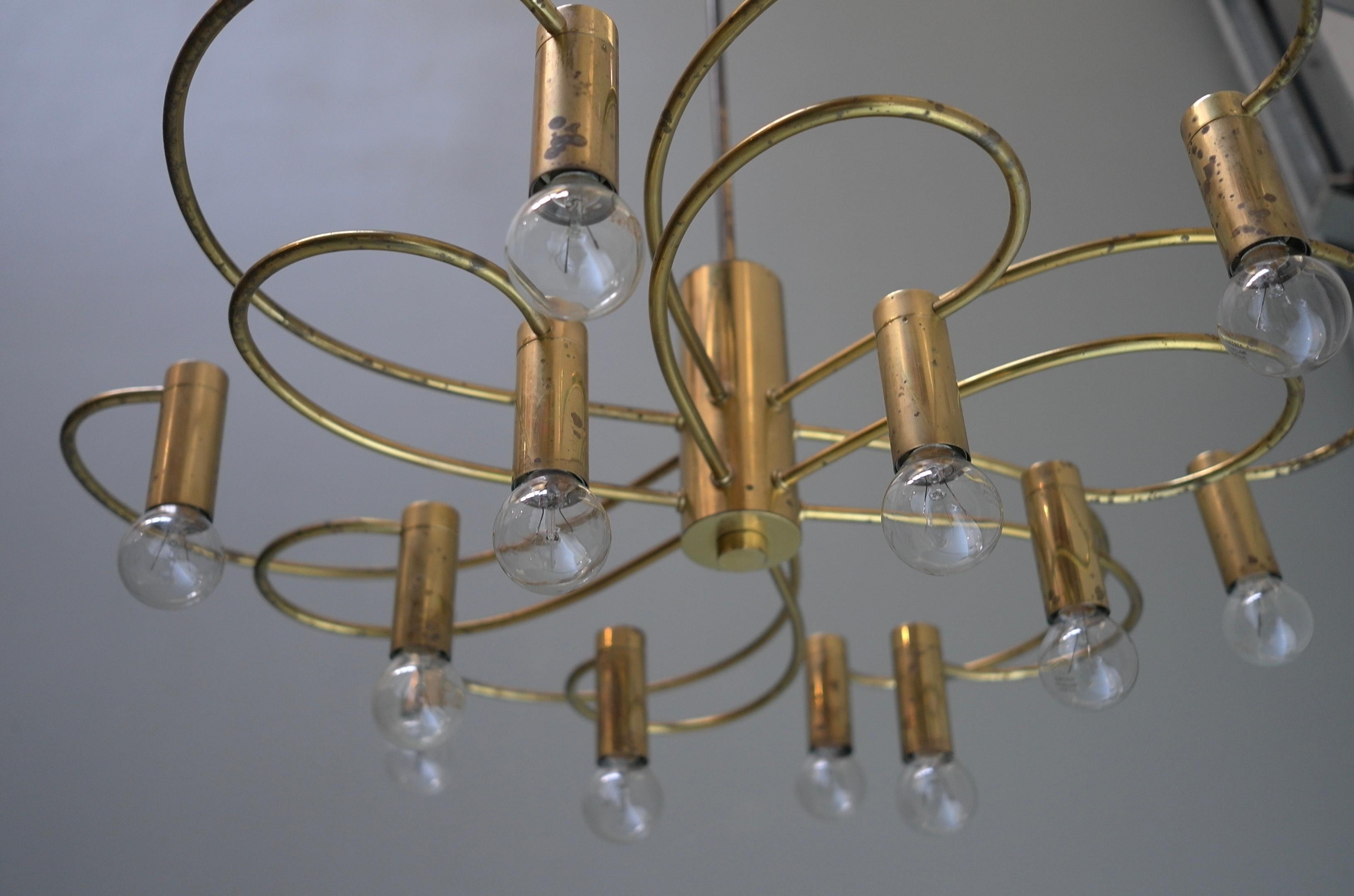 Gaetano Brass Sciolari Twelve-light chandelier, Italy, 1960s.

In very good vintage condition with beautiful Patina to the brass. Three lamps are available, priced per piece.