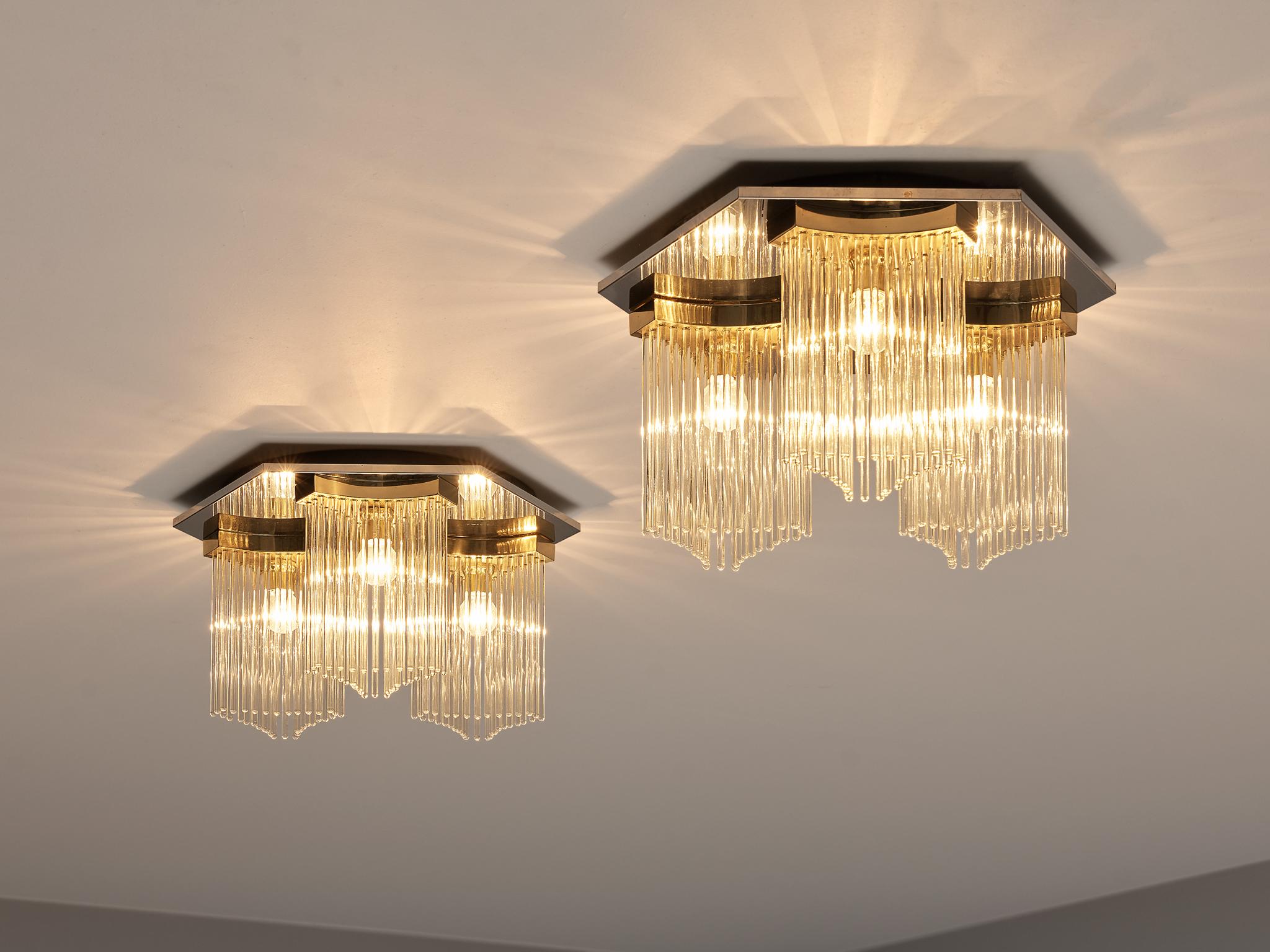 Gaetano Sciolari ceiling lights, glass, metal, Europe, 1980s

Stunning ceiling lights designed by Gaetano Sciolari in the 1980s. On a polygonal ceiling fixture are three light bulbs adjusted. These are surrounded by long glass prisms arranged by