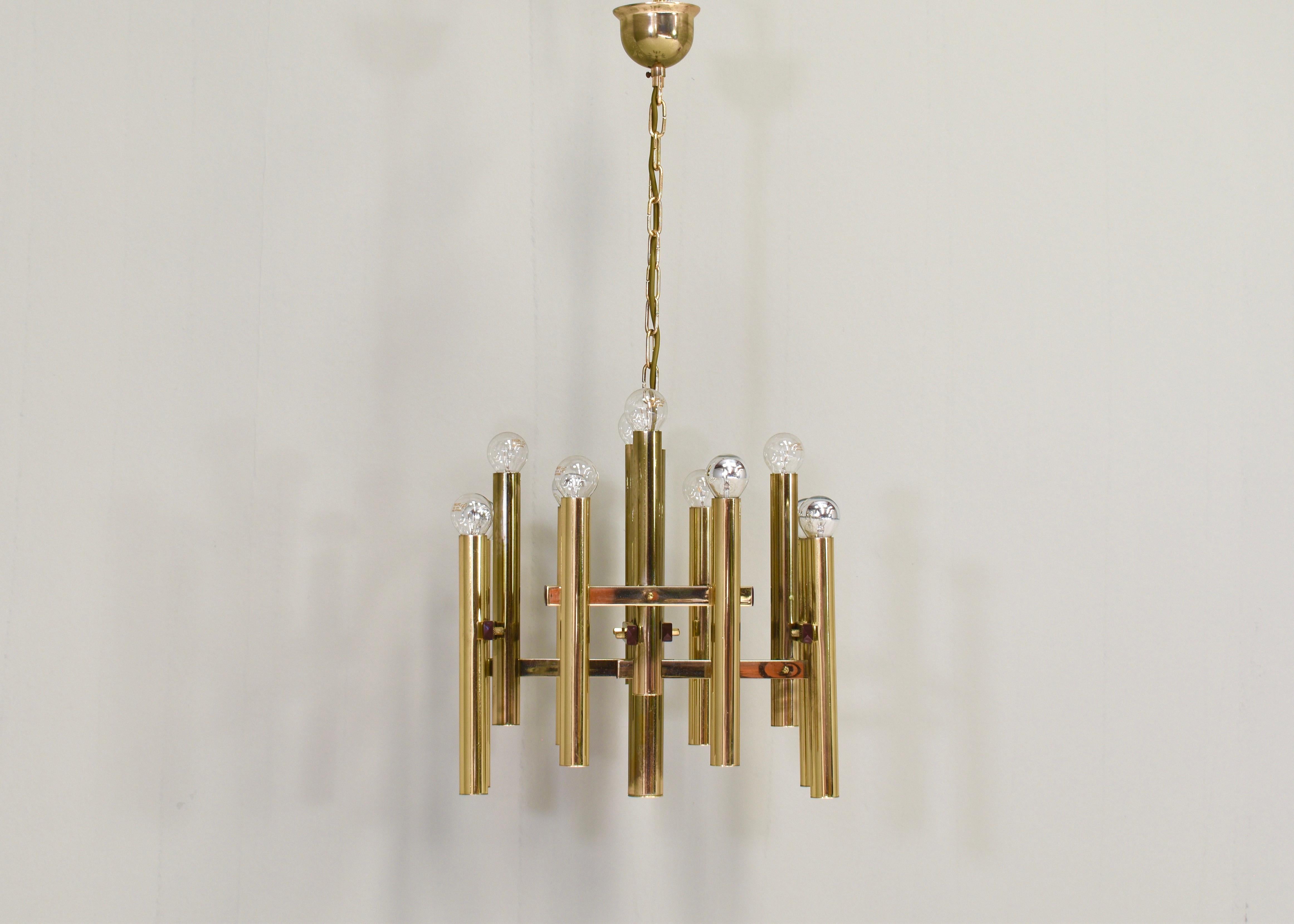 Brass 12 scone pendant lamp / chandelier by Gaetano Sciolari for Sciolari Lighting, Italy - circa 1970.
 