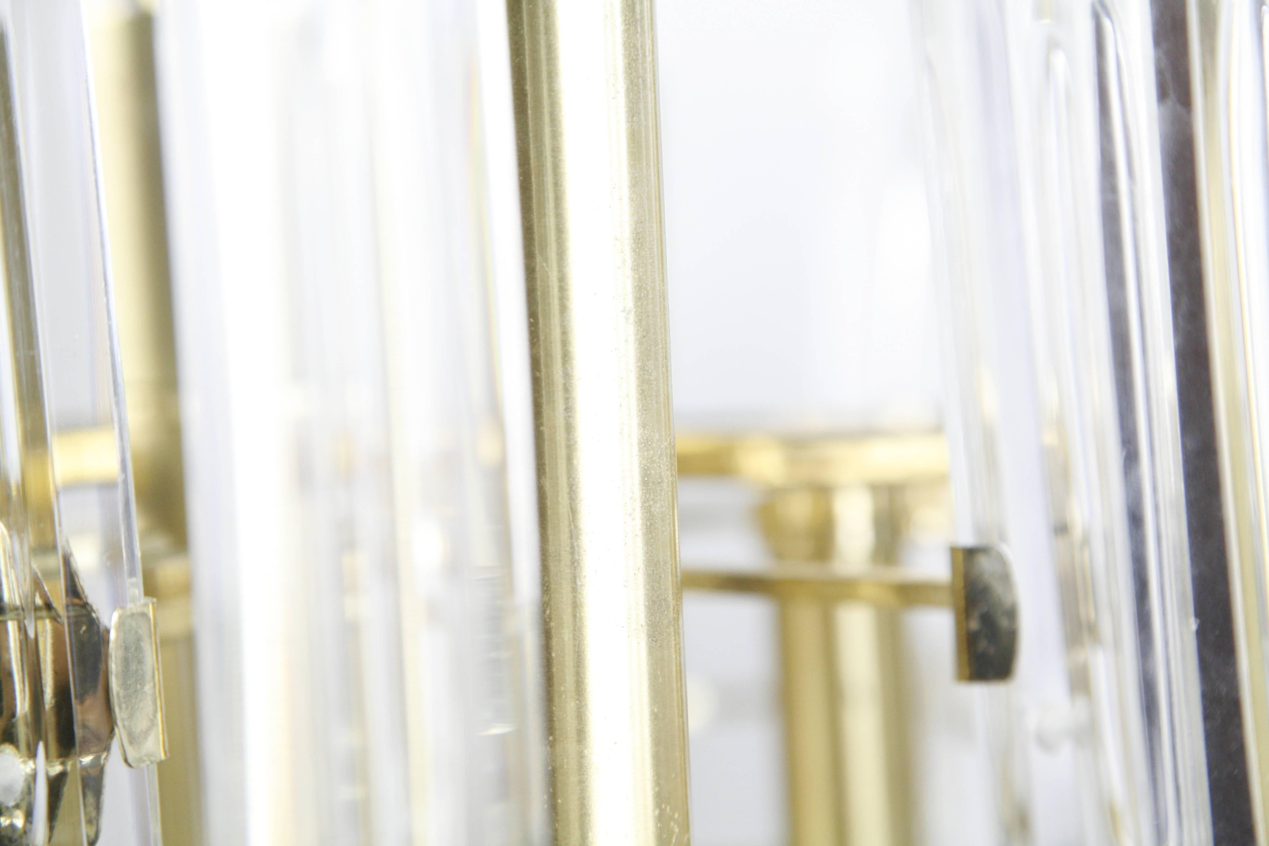 Gaetano Sciolari brass chandelier with crystal ellipse shaped ornaments, 1960 Italy with 22 long ellipse shaped crystal pieces, the frame has aged with patina, each crystal is 9