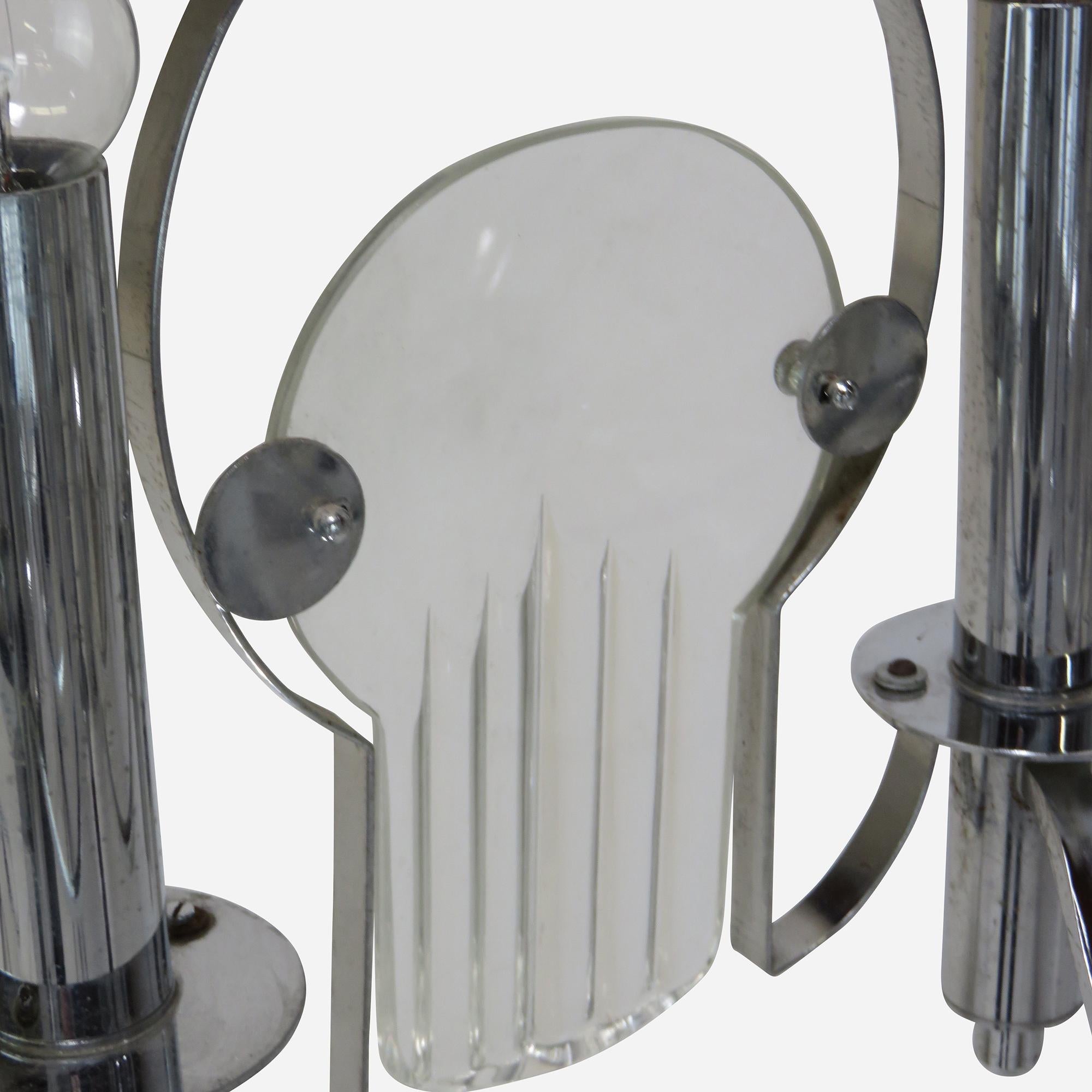 An eight-arm chrome and glass chandelier by Gaetano Sciolari.
Needs rewiring.

