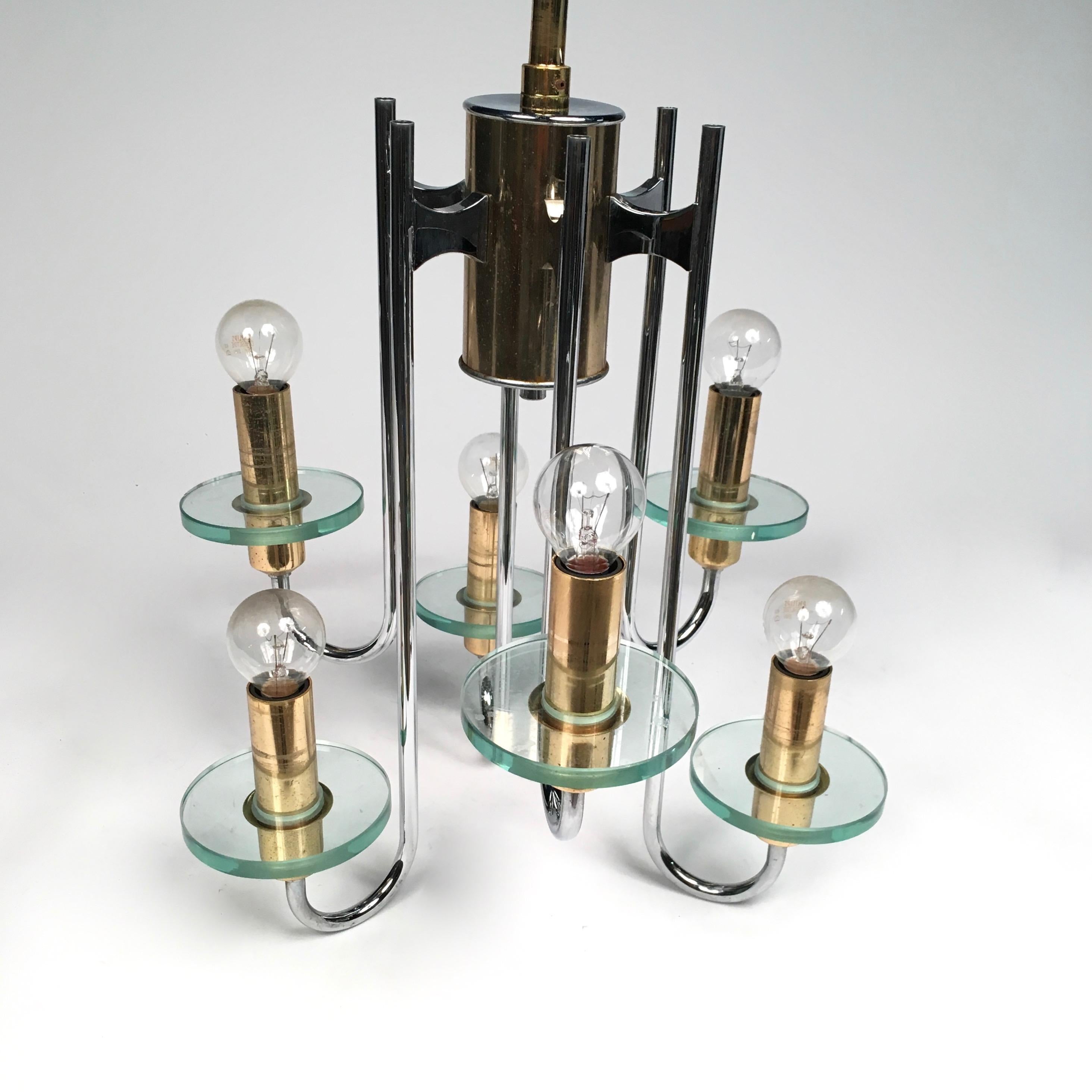 A six-arm chandelier with enameled candlesticks, made of glass, brass and chrome, by Sciolari.
 