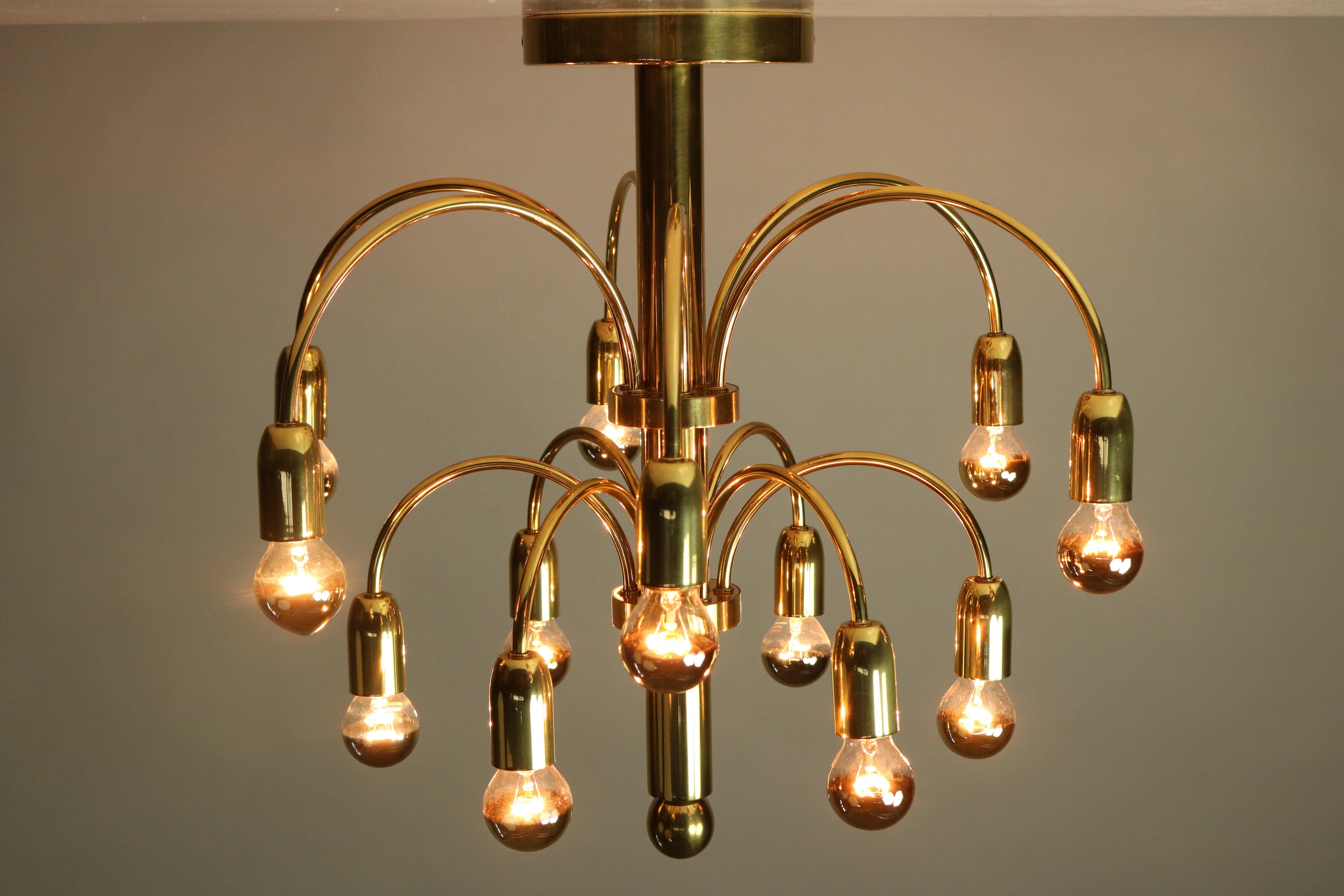1970s design chandelier
high quality made of brass with 12 arms and 12 lights
you need small Edison screw bulbs to operate
not included in this offer, the wiring is renewed and 110 - 250 V safe
Measures without bulbs:
diameter 20'', height