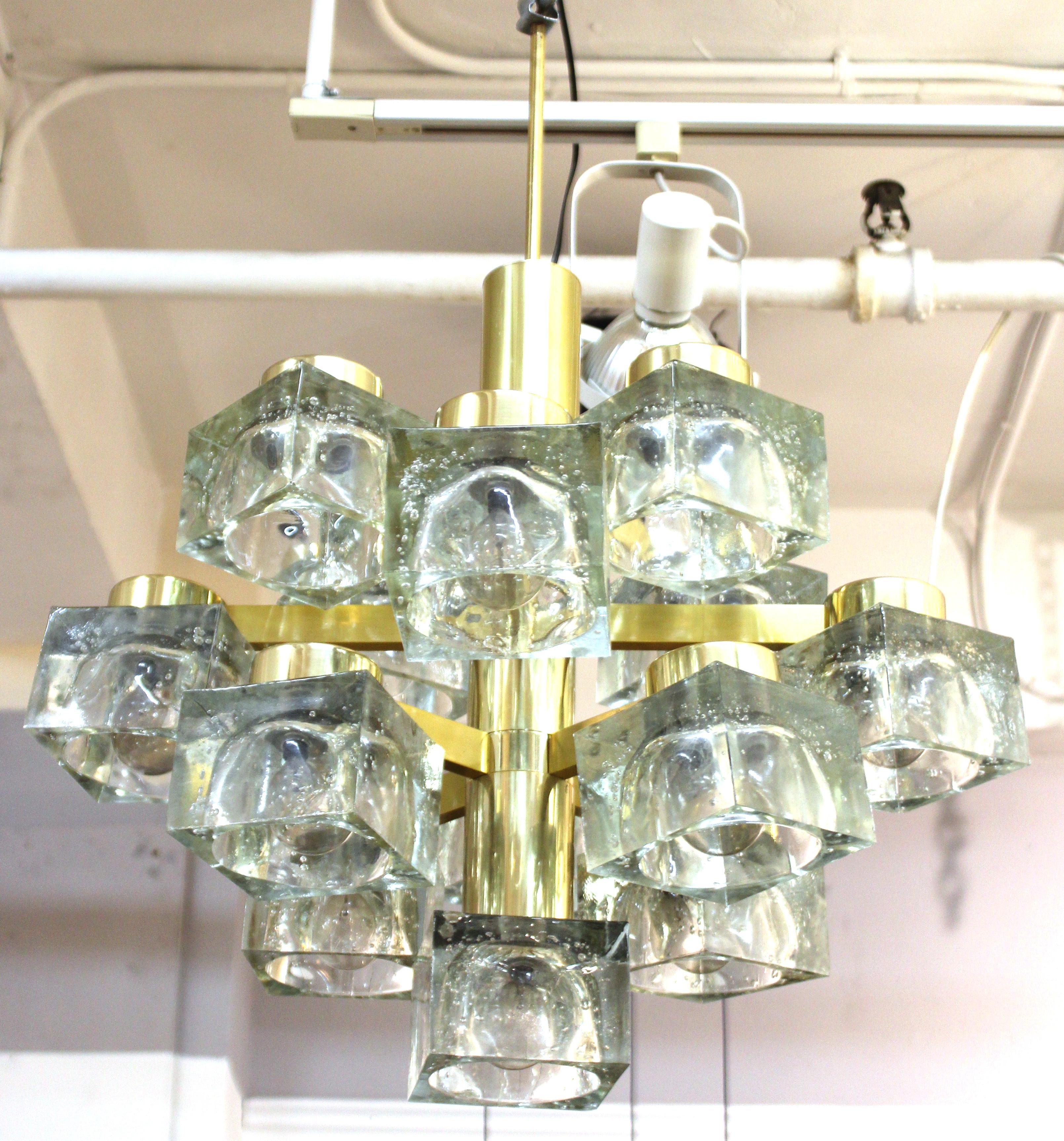 Italian modern heavy frosted glass cube chandelier designed by Gaetano Sciolari for Lightolier. The piece has multiple levels of frosted glass cubes on a brass structure. Designed in Italy in the 1970s, this piece is in great vintage condition.