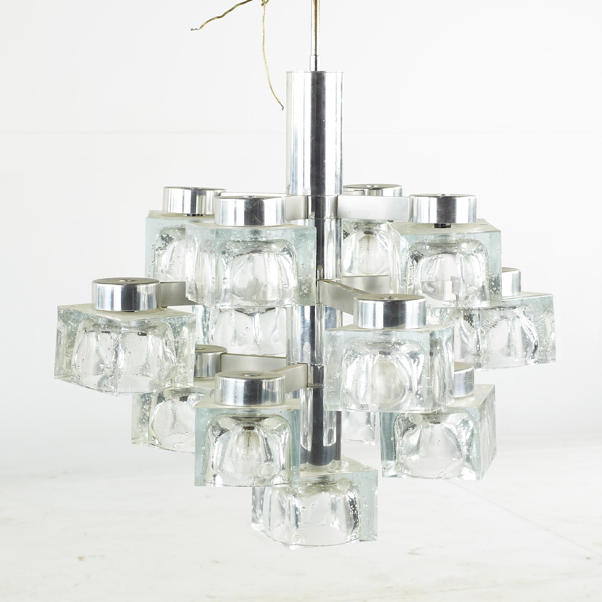 Gaetano Sciolari for Lightolier mid-century Italian chrome and glass ice cube chandelier

This chandelier measures: 22 wide x 22 deep x 32 inches high

We take our photos in a controlled lighting studio to show as much detail as possible. We do