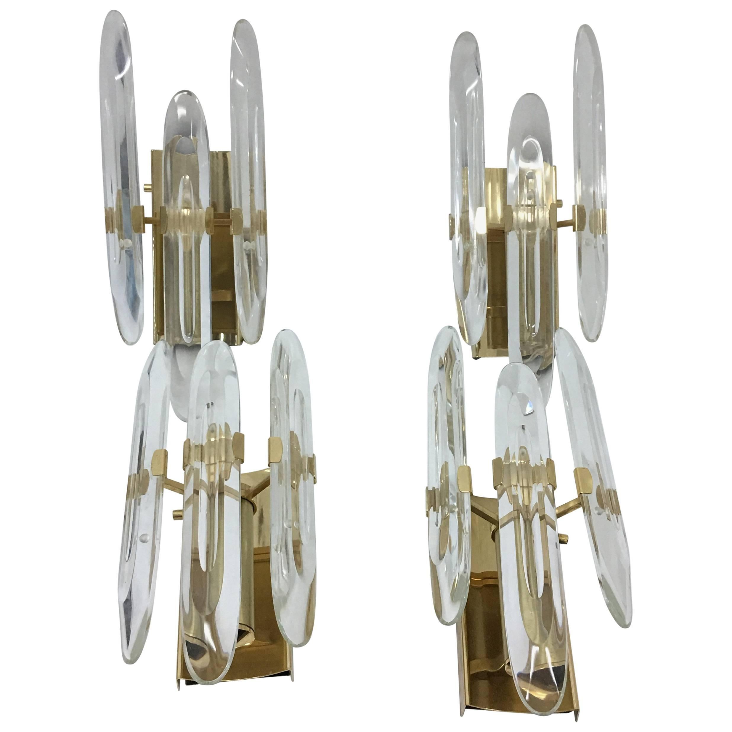 Six Italian turnable wall sconces designed by Gaetano Sciolari. They are in perfect conditions. Brass and optical glasses. Work with both 110 and 220 Volt and need regular e14 bulbs.