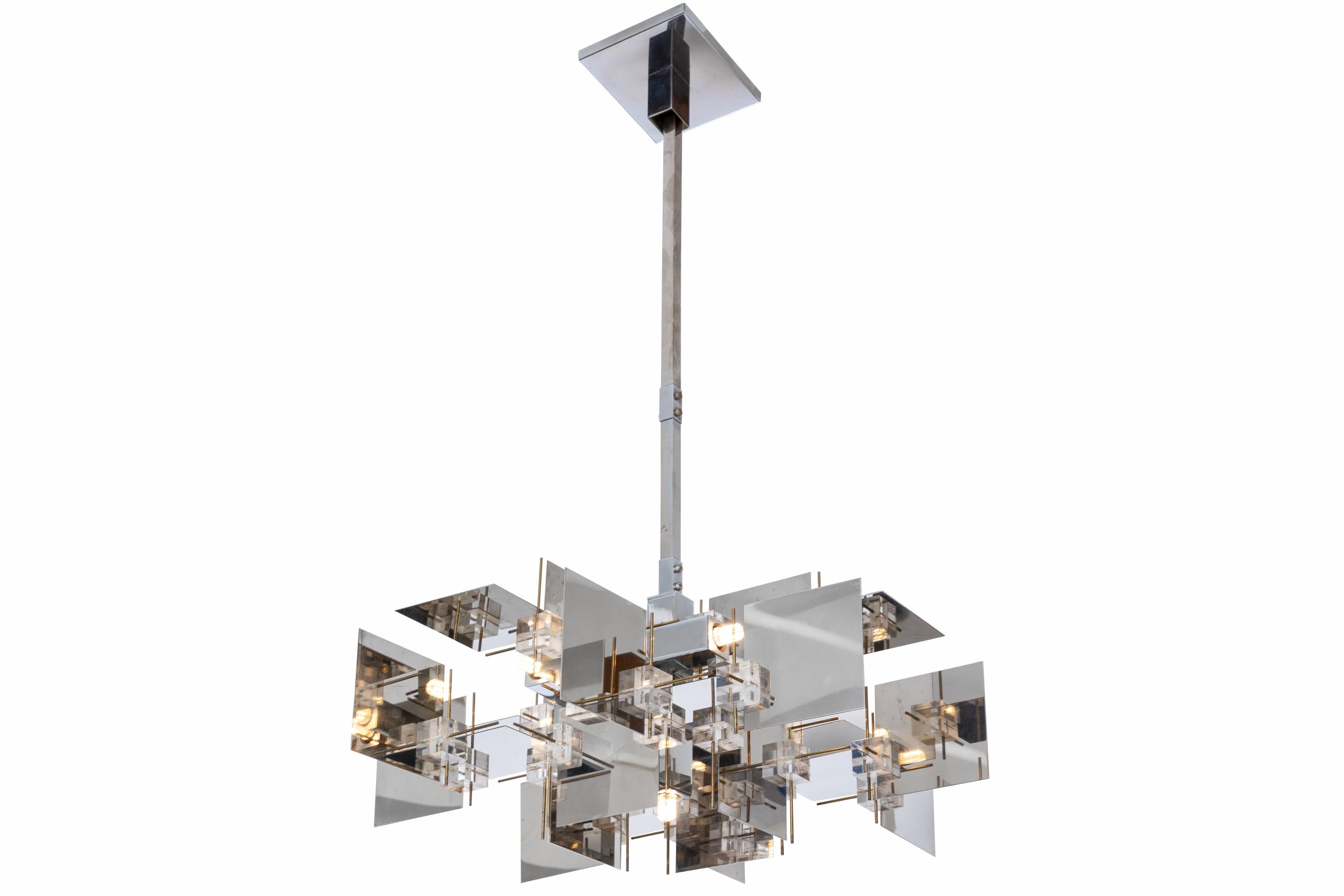 A rare and impressive chandelier by Gaetano Sciolari. The chrome panels create a wonderful effect reflecting the light at every angle. There is some discoloration to the Lucite cubes that is only apparent when observed closely.

  