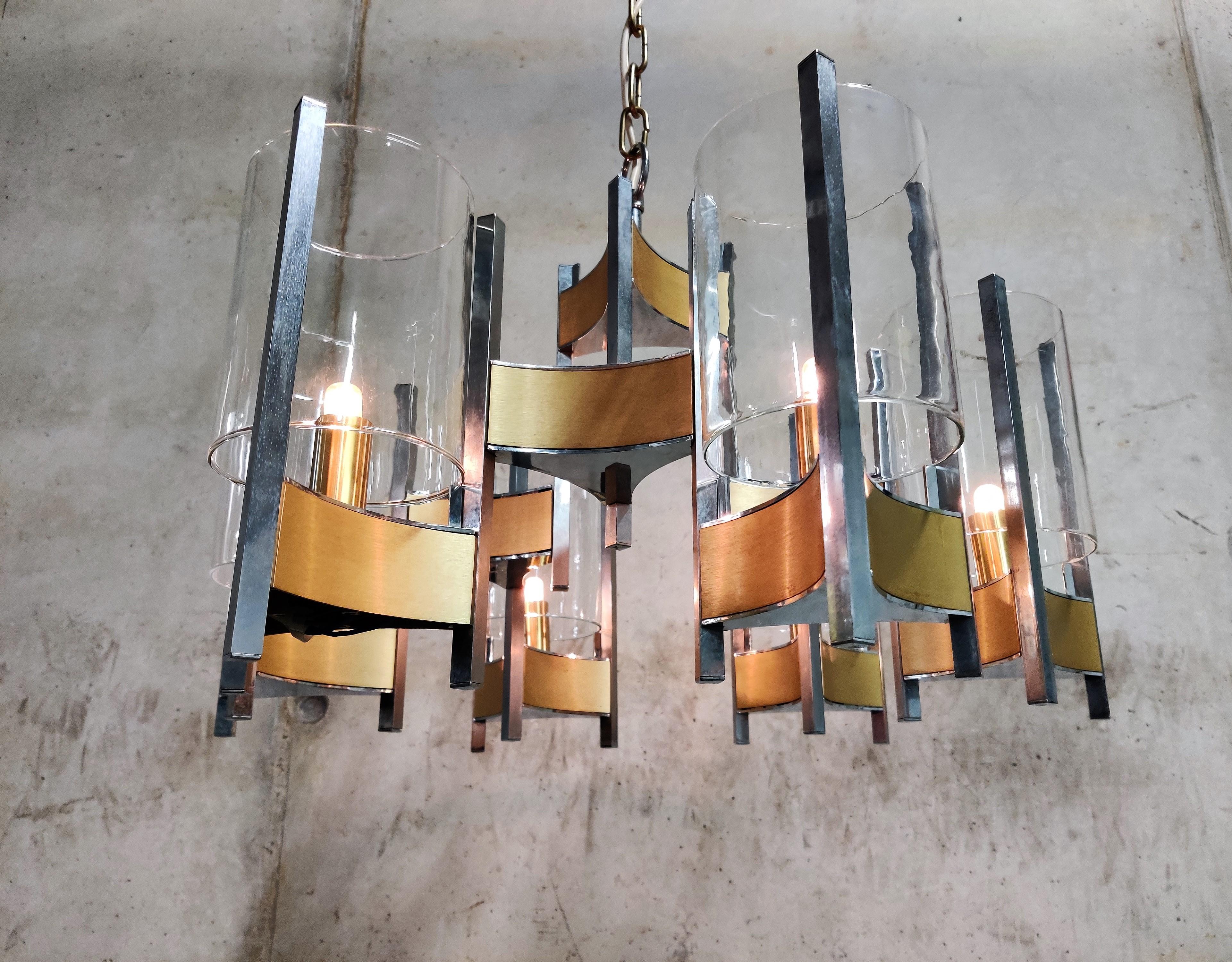 Beautiful 'hurricane' chandelier by Gaetano Sciolari with 6 lightpoints/glasses

Stunning timeless design that emits a beautiful light.

It can be used with regular E14 candle light bulbs.

1970s - Italy

tested and ready to use.

Dimensions:
Height